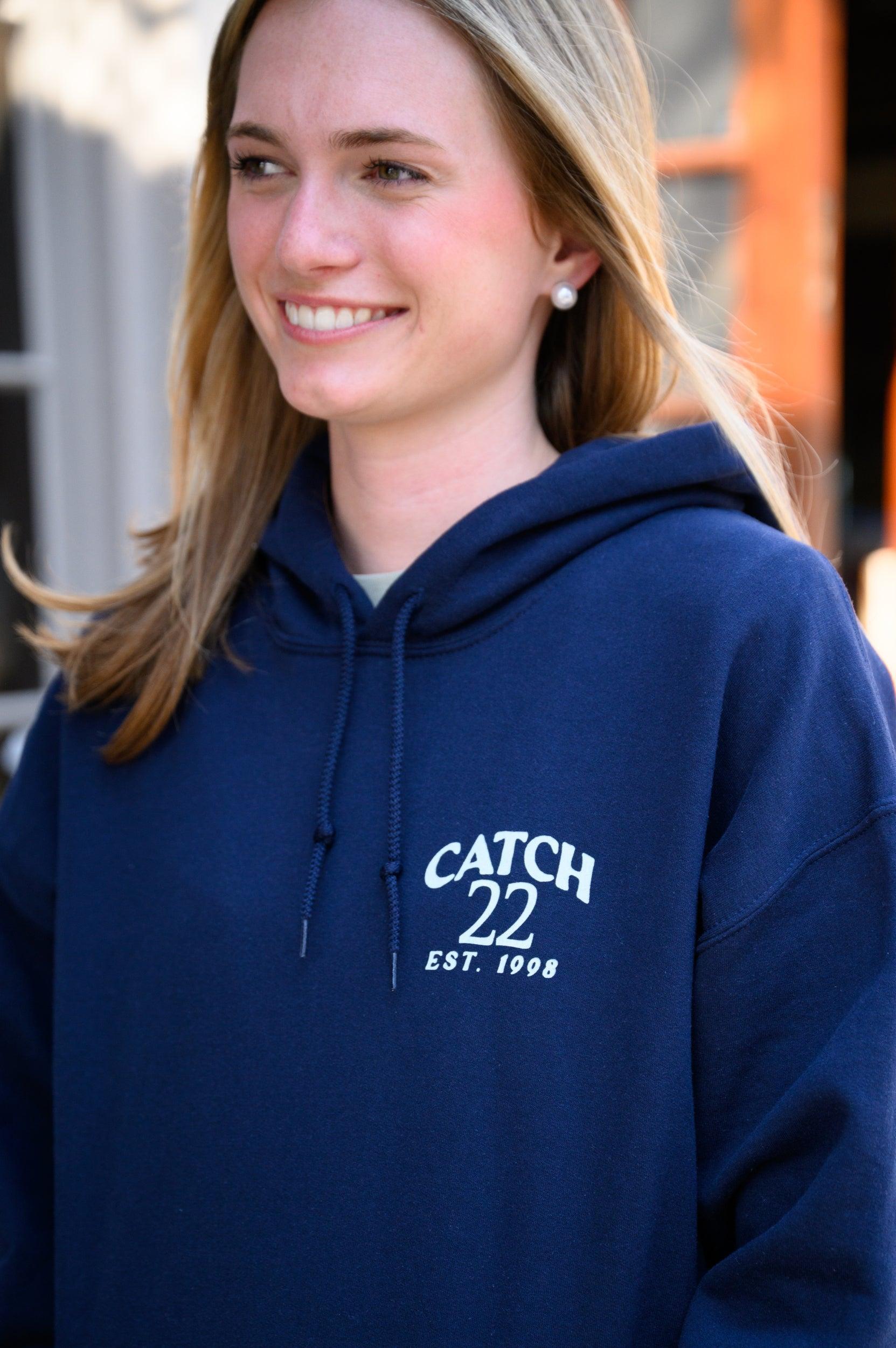 Left chest design with Seafoam Green text “Catch 22- EST. 1998”