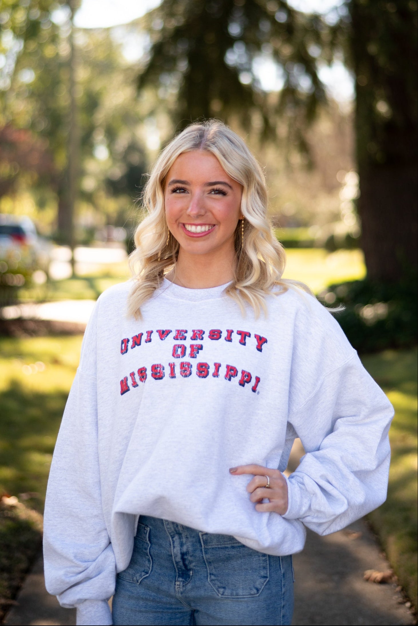 Ole Miss Light Grey Sweatshirt with Red text “University of Mississippi”