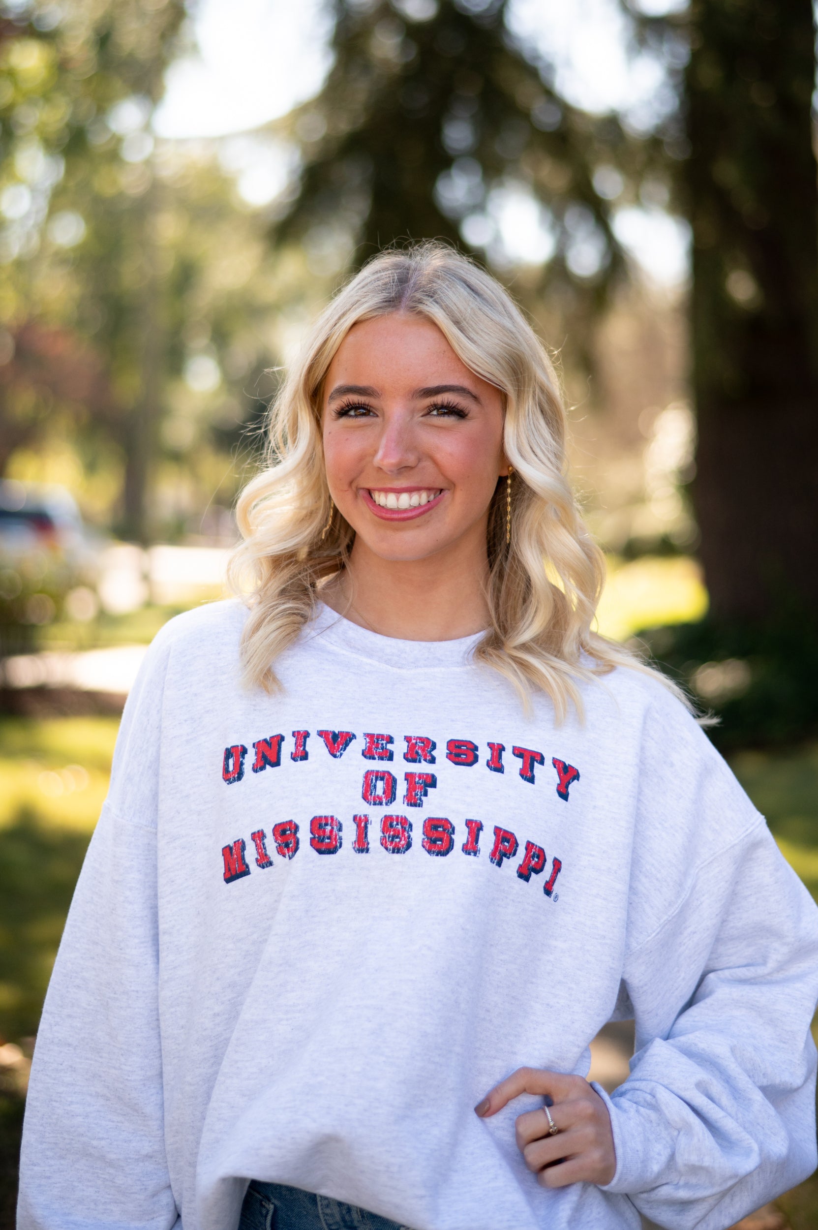 Ole Miss Light Grey Sweatshirt with Red text “University of Mississippi”