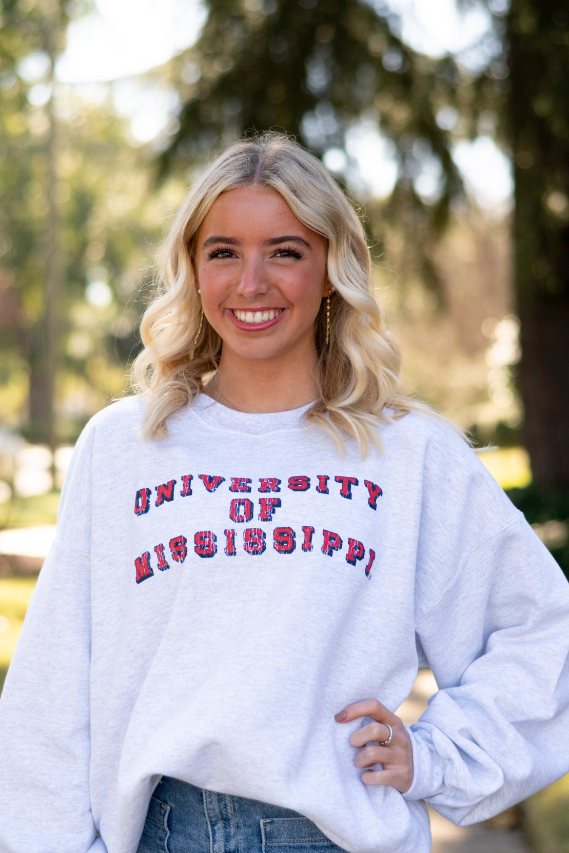 Ole Miss Light Grey Sweatshirt with Red text “University of Mississippi”