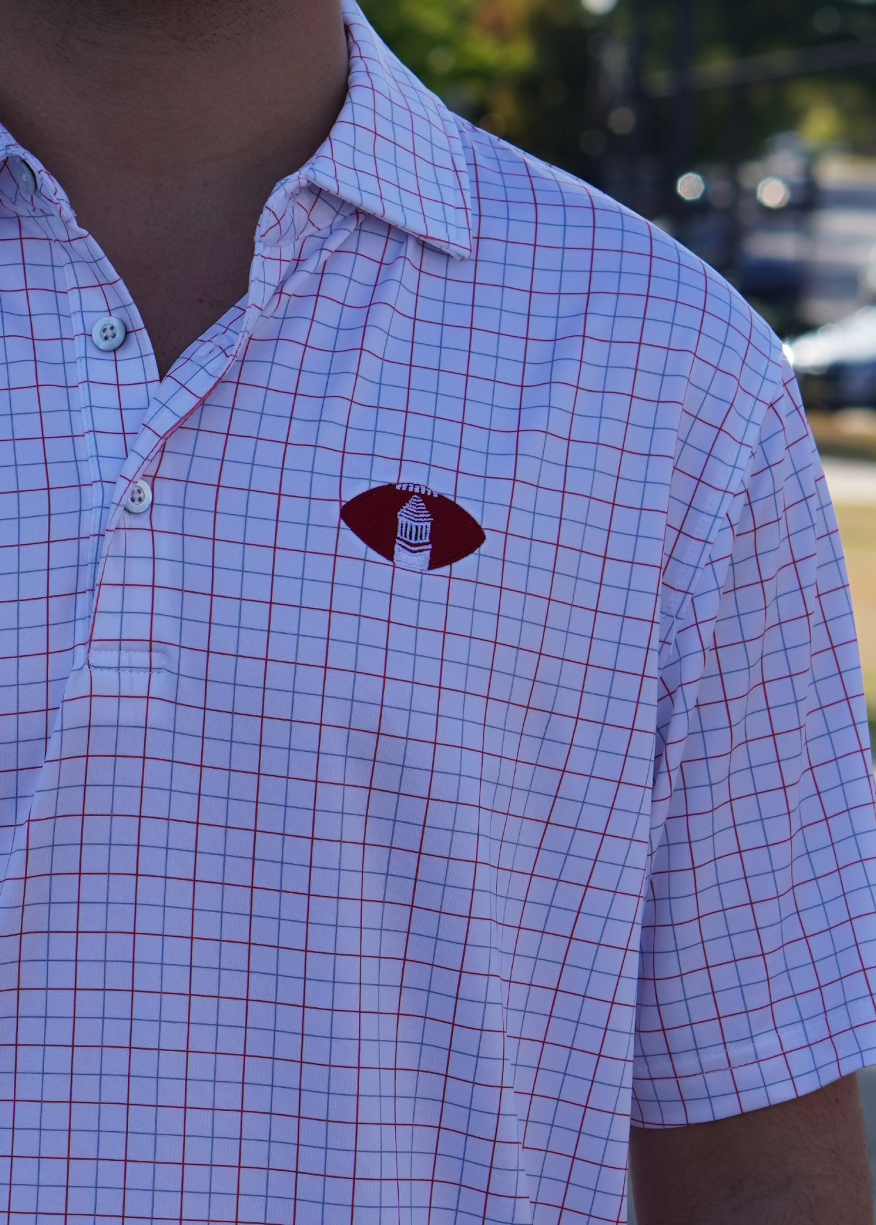 University of Alabama Red/Blue/White patterned Men’s Polo with Denney Chimes in a football embroidered on the chest 