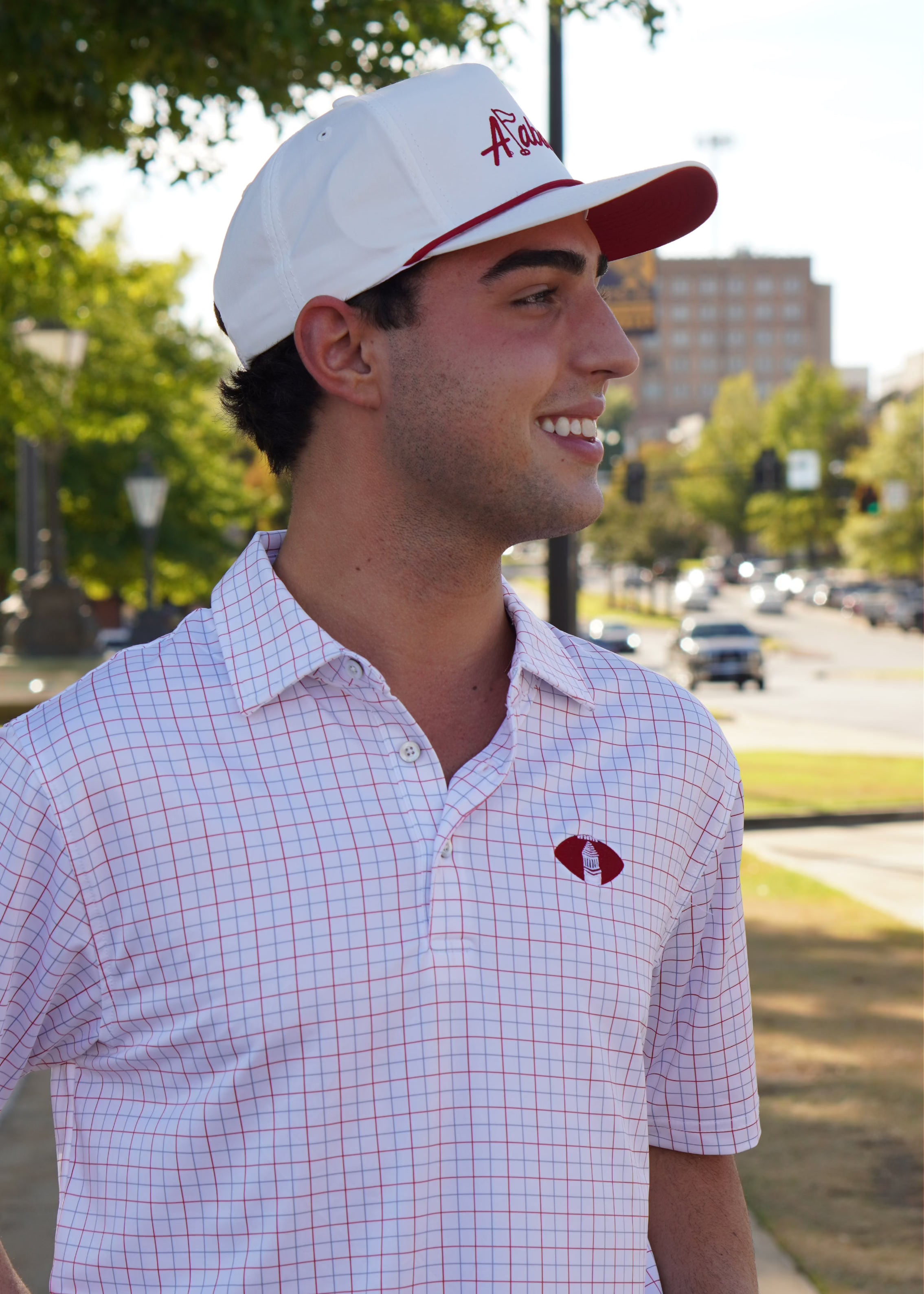 University of Alabama Red/Blue/White patterned Men’s Polo with Denney Chimes in a football embroidered on the chest 