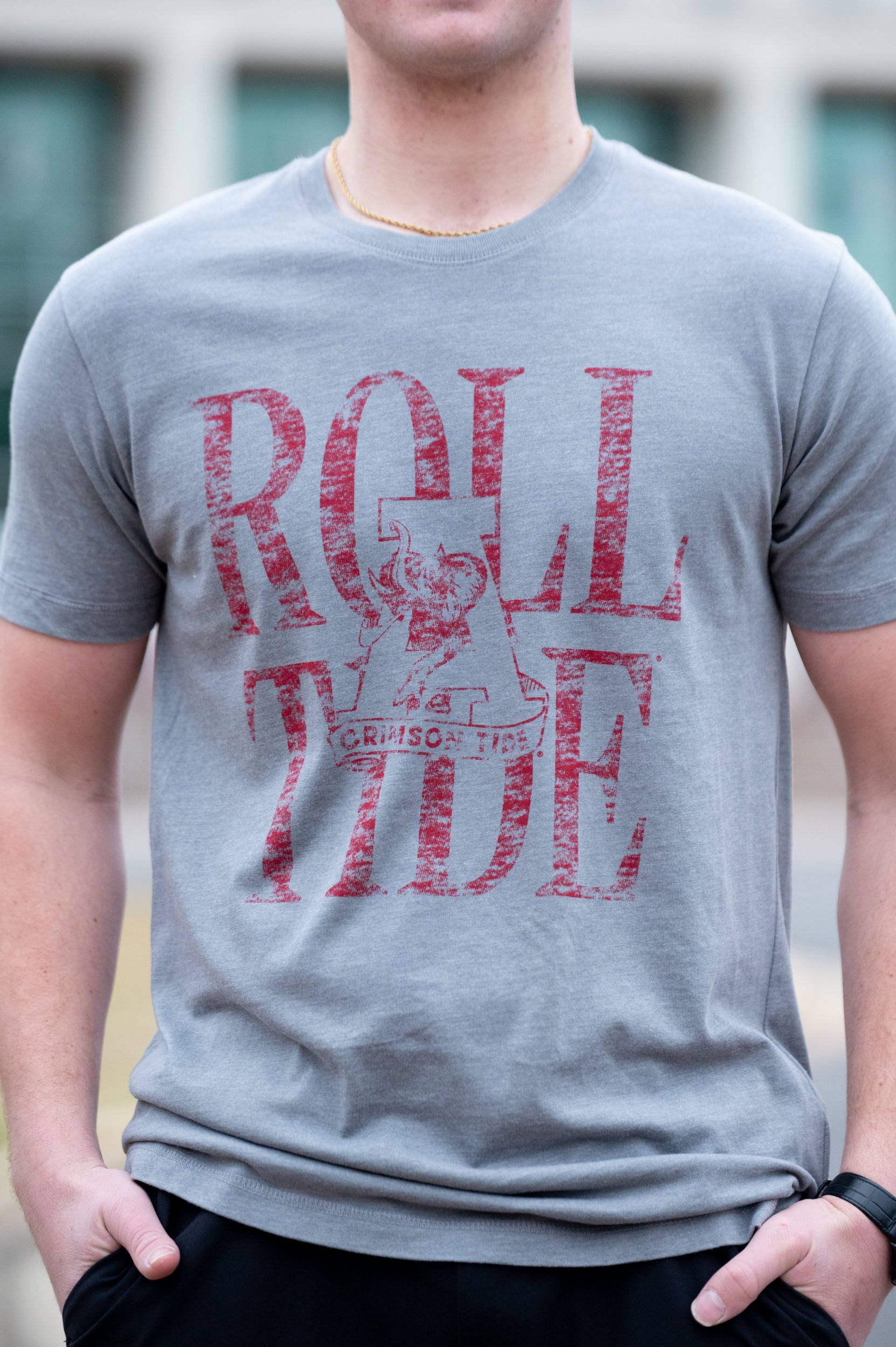 University of Alabama Grey T-Shirt with a distressed print of the Vintage A logo in front of Red text “Roll Tide”