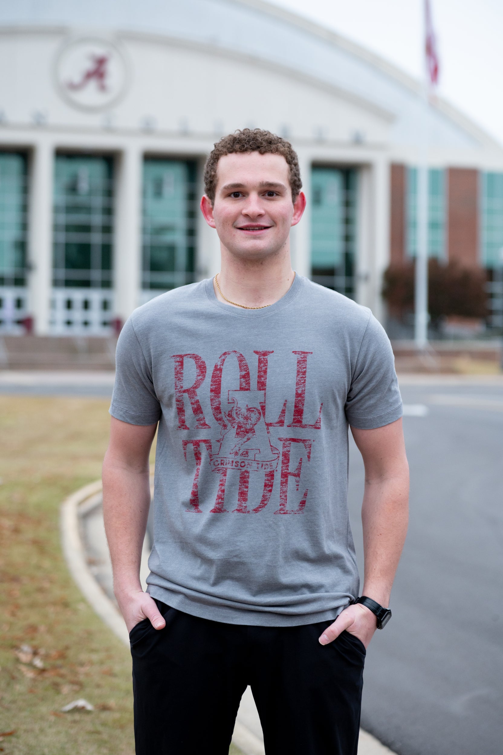 University of Alabama Grey T-Shirt with a distressed print of the Vintage A logo in front of Red text “Roll Tide”