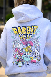 Grey Rabbit Hole Hoodie with marquee lights spelling "Rabbit Hole" lighting a band of Alice in Wonderland characters surrounded by playing cards