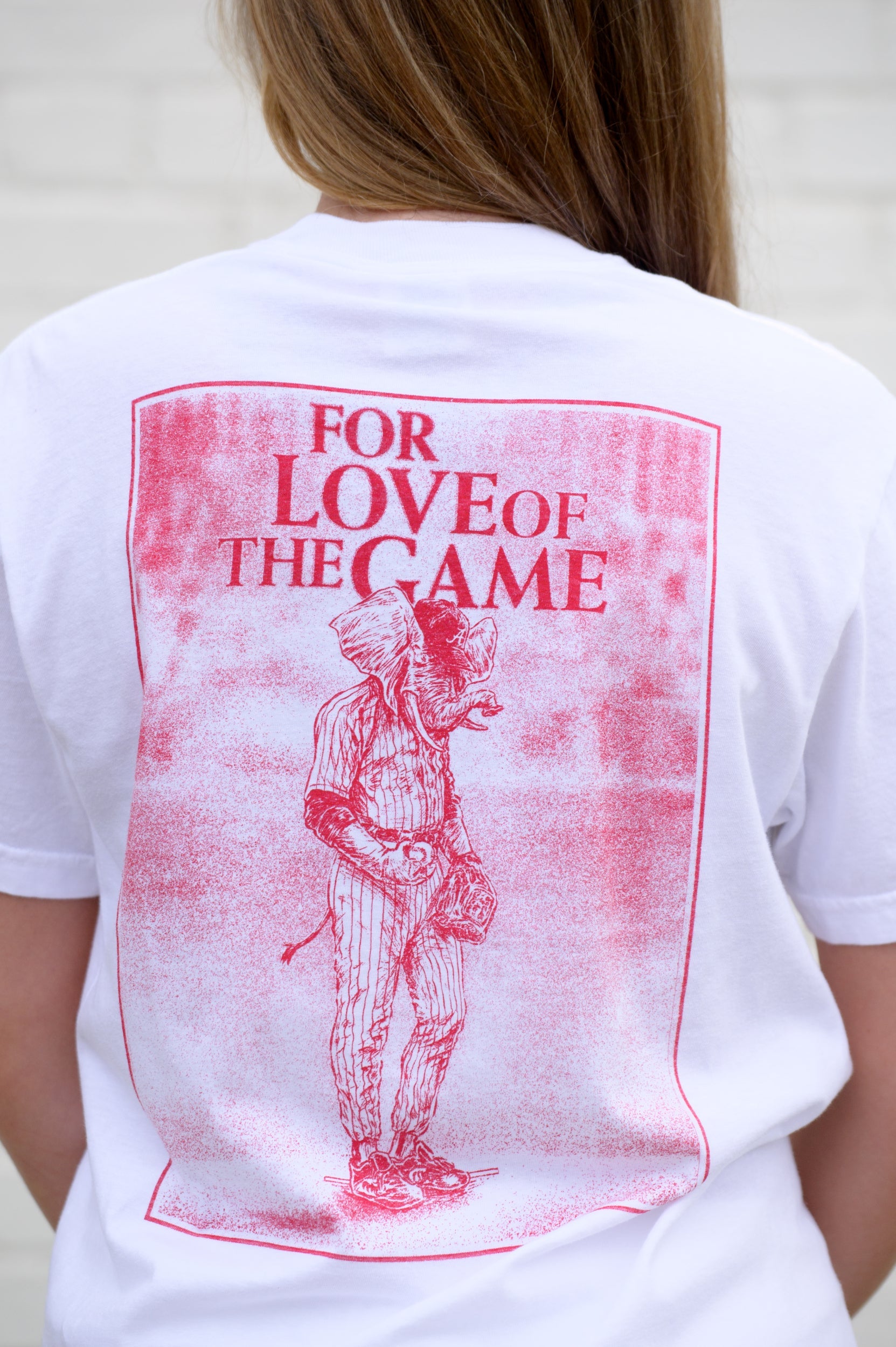 University of Alabama White T-Shirt with a Red illustration of Big Al in baseball gear below Red text "For The Love of The Game