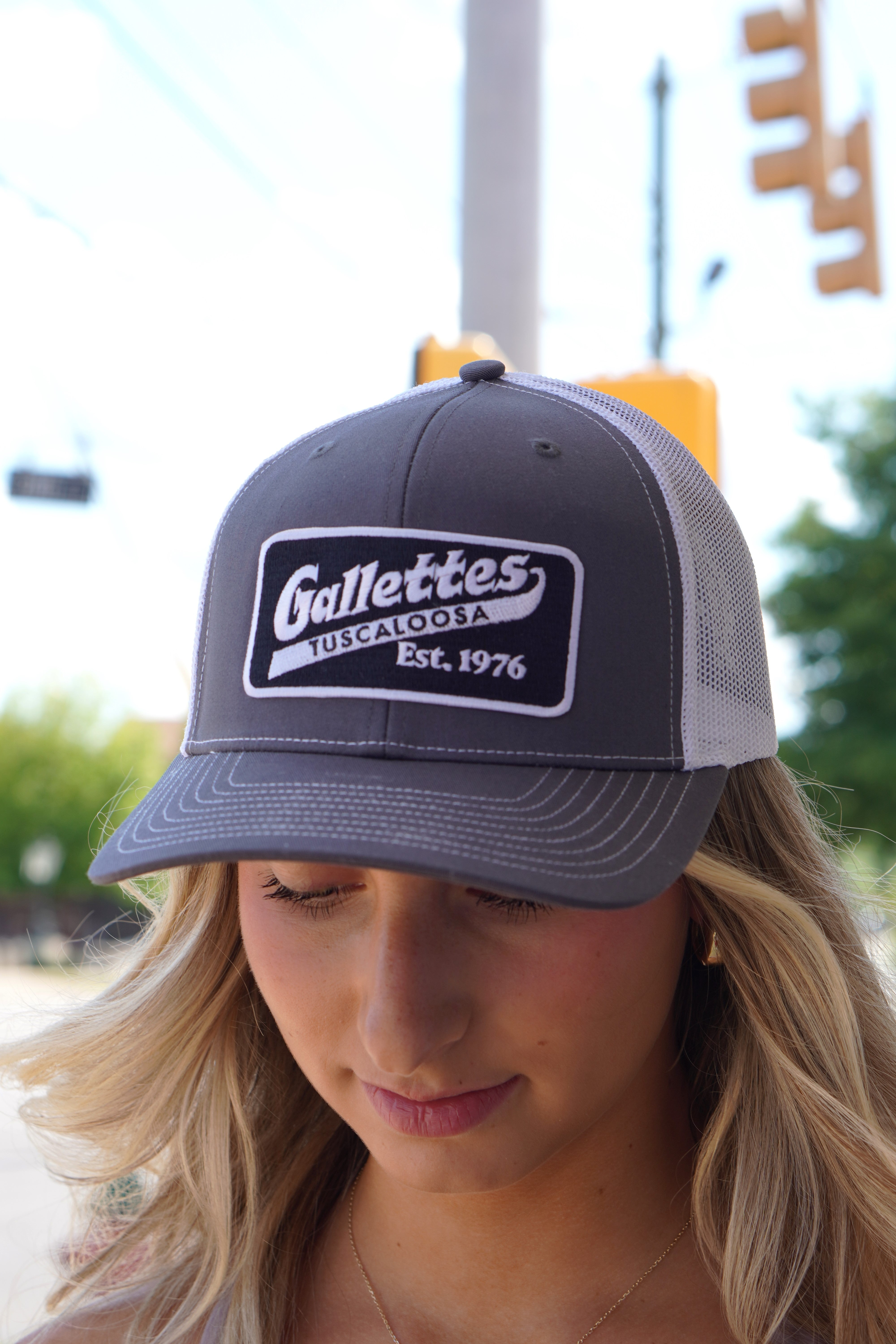 Gallettes Grey Trucker Hat with a Black Patch that features the Gallettes Logo in White embroidery
