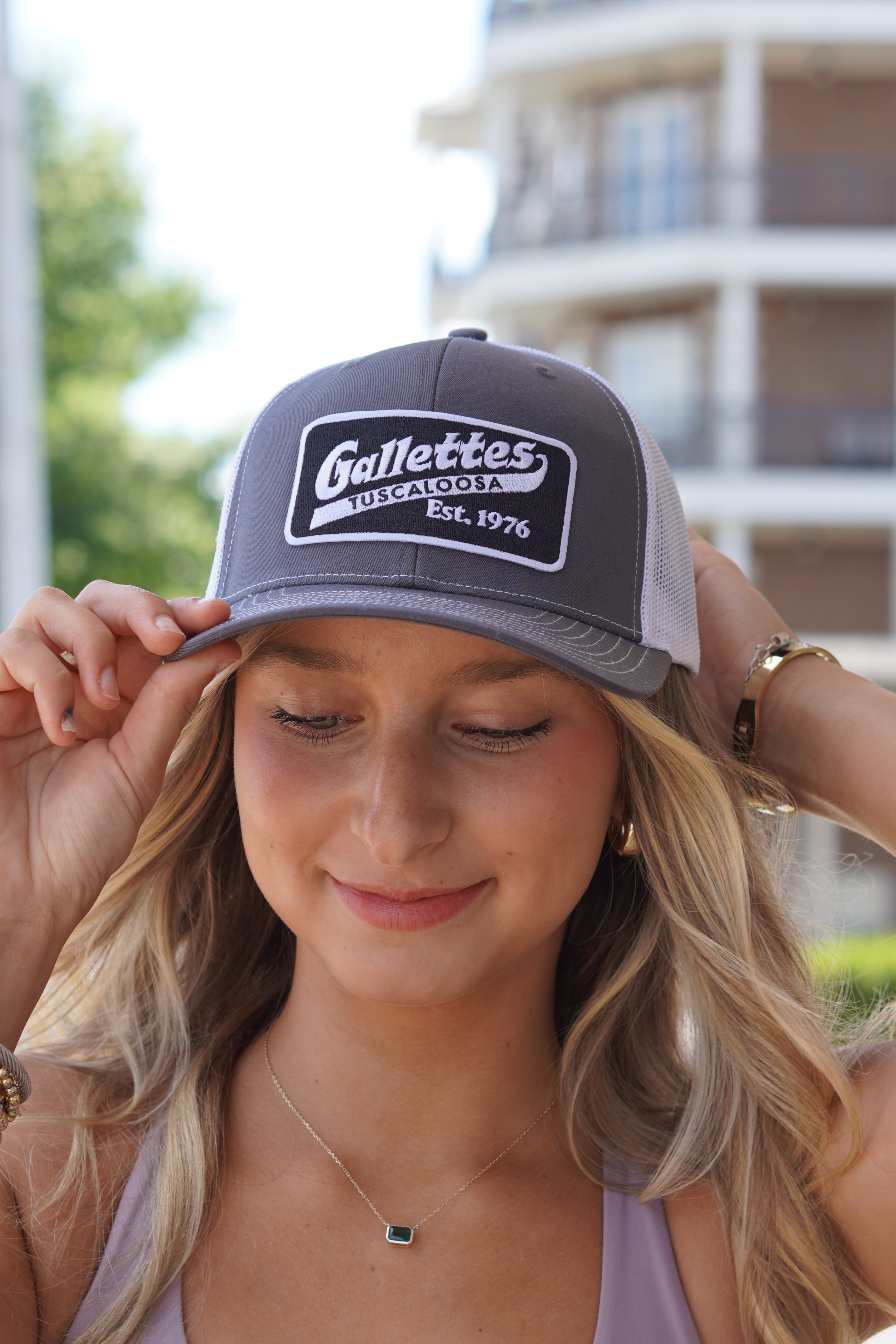 Gallettes Grey Trucker Hat with a Black Patch that features the Gallettes Logo in White embroidery