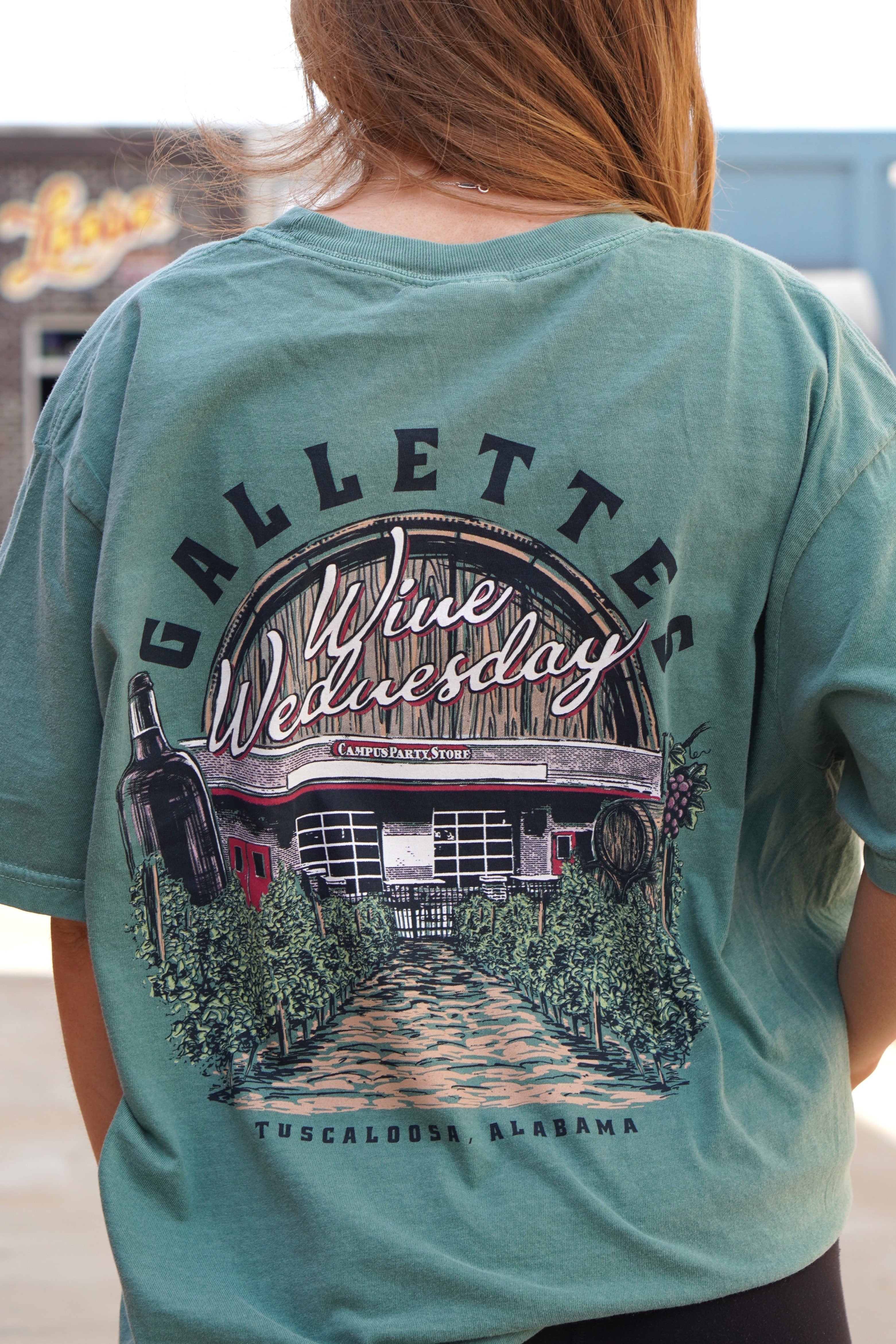 Gallettes Green Wine Wednesday T-Shirt with an image of the Gallettes Building in a vineyard in front of a wine barrel with White text "Wine Wednesday  