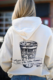 Gallettes Tan Hoodie with an illustration of a yellow hammer drink with a sash that reads “home of the yellow hammer”