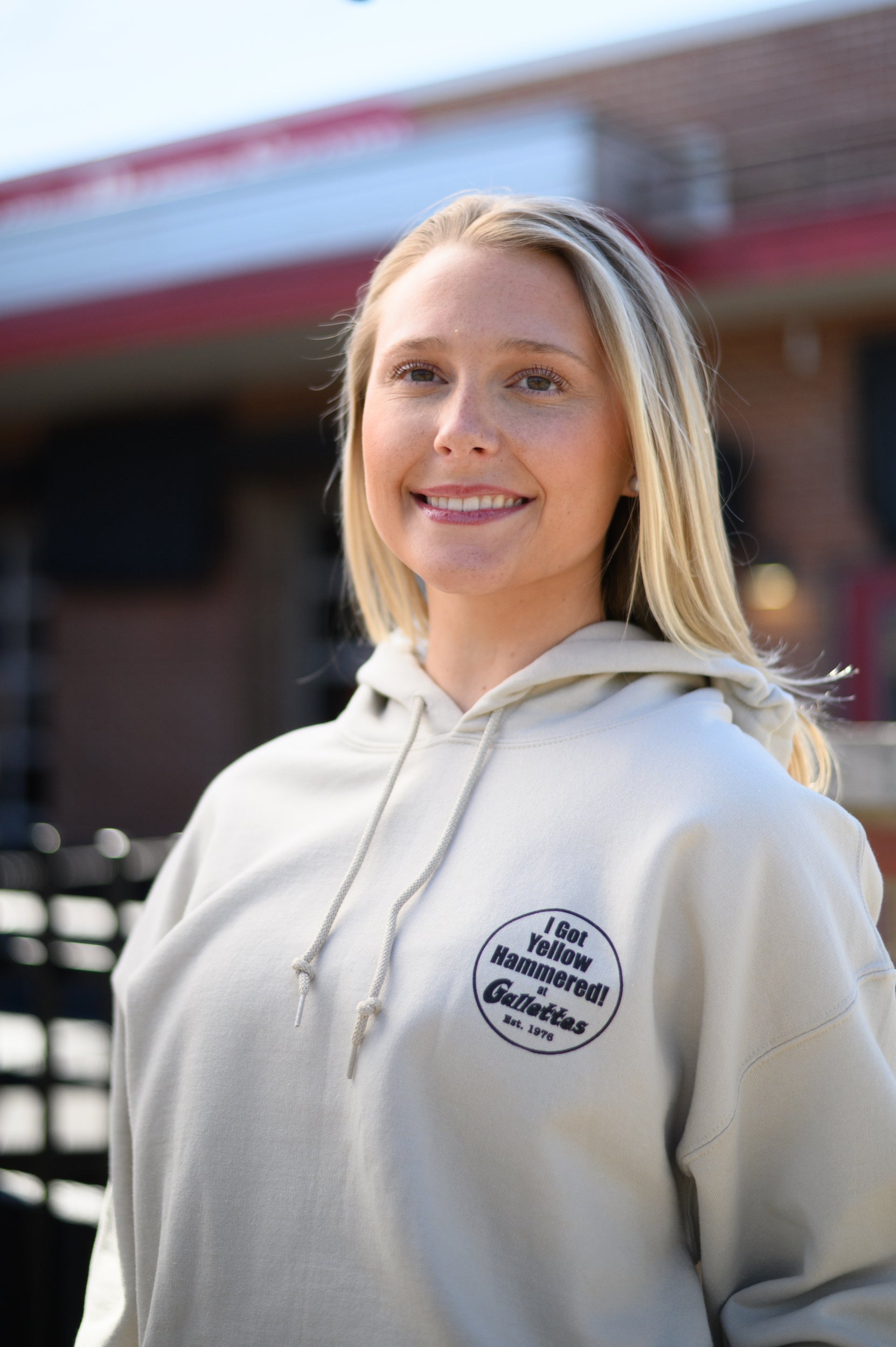 Gallettes Tan Hoodie with an “I Got Yellow Hammered at Gallettes” left chest design