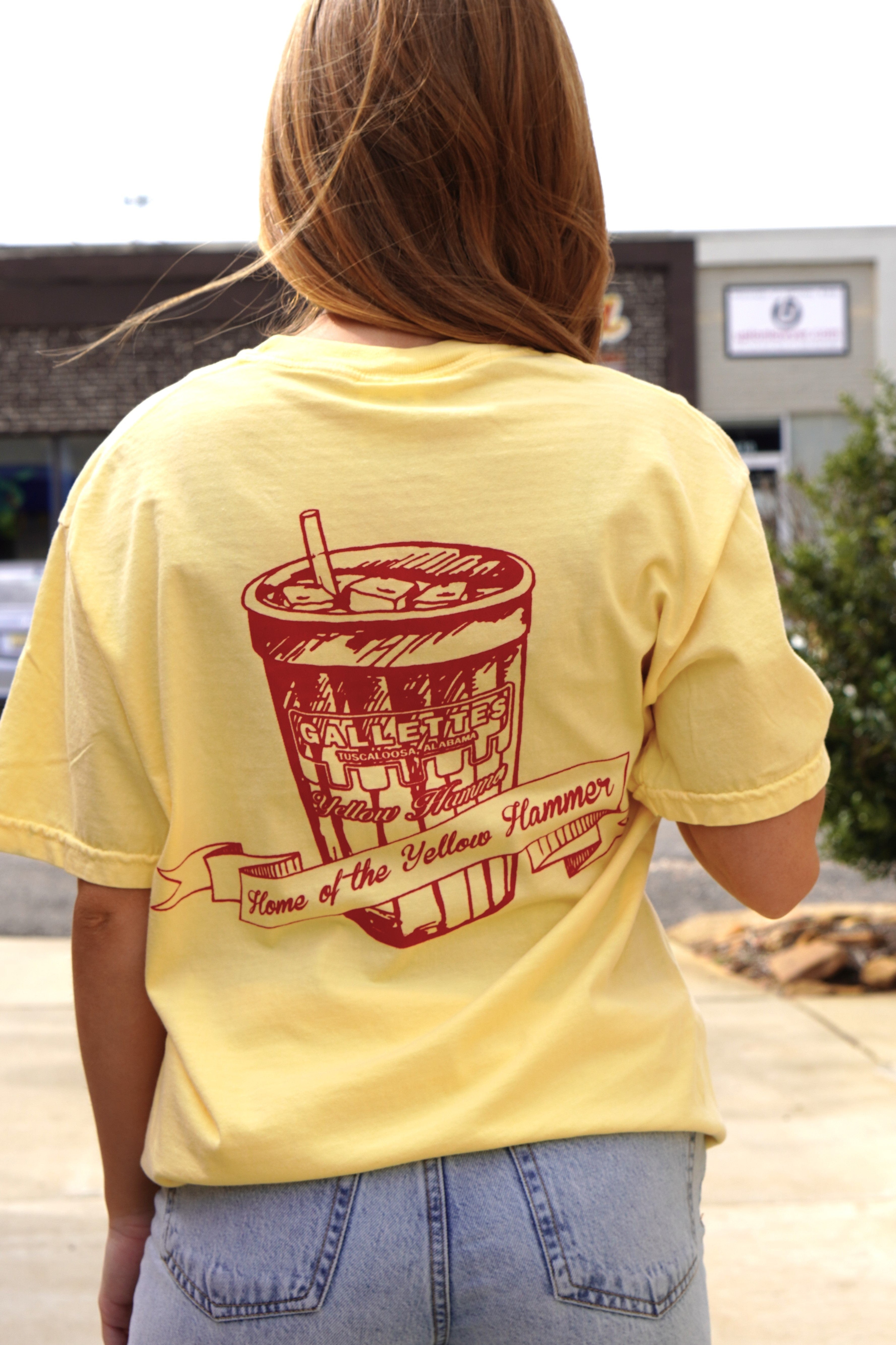Gallettes Yellow T-Shirt with a Red illustration of a full Gallettes cup behind a banner with  text "Home of the Yellow Hammer" and a Font Pocket with Red "I Got Yellow Hammered"