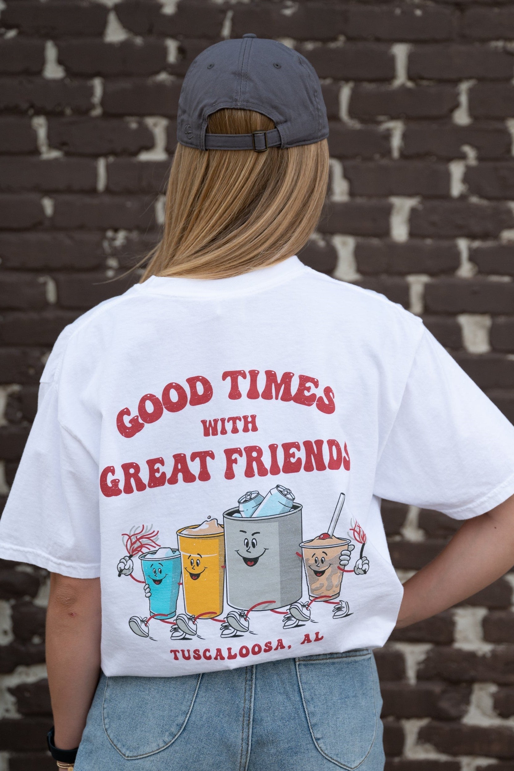 Good Times Tuscaloosa White T-Shirt with Red text "Good Times with Great Friends" above drinks walking together and holding shakers 