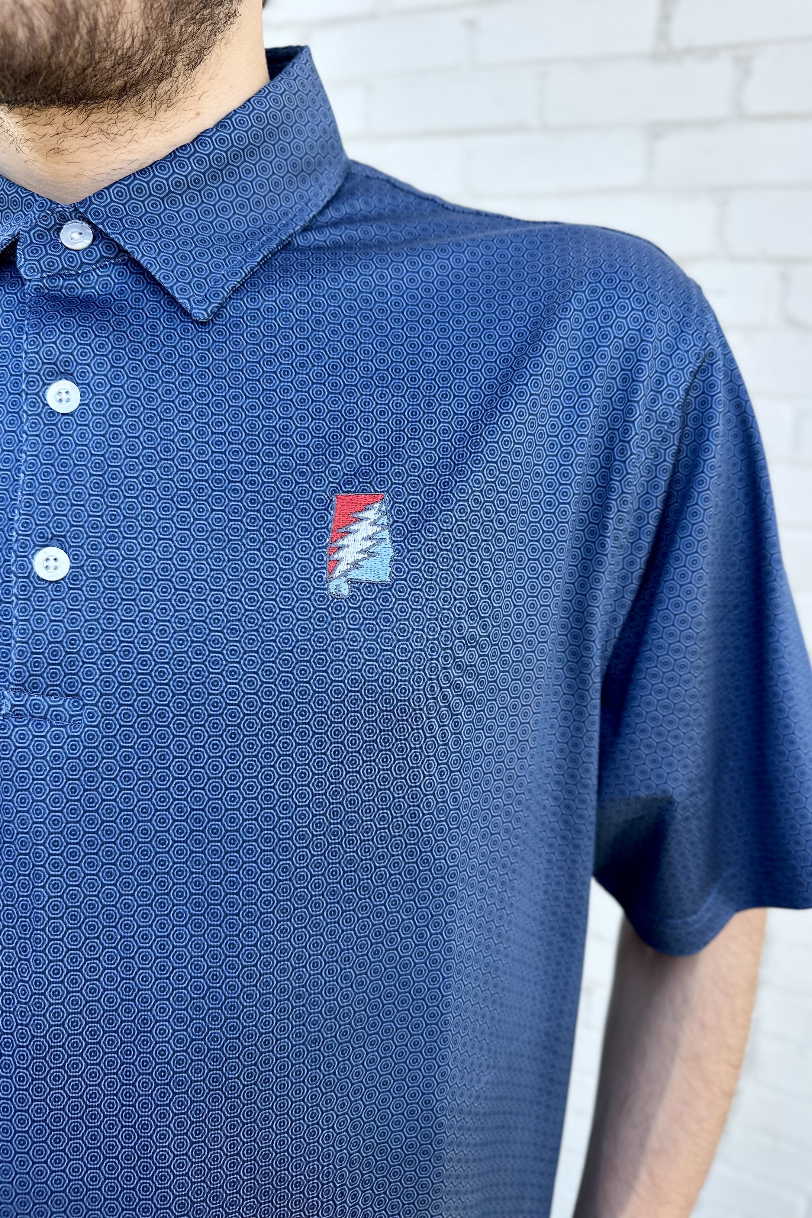 Grateful State Navy Men’s Hex Polo with Red and Blue embroidery of the Alabama "Grateful State" Logo
