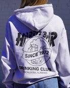 Harry’s Bar Grey Sweatshirt with an image of an overflowing beer mug with a sash reading “Since 1972” above the text “Drinking Club”