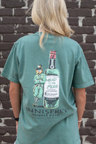Innisfree Green T-Shirt with a hand-drawn design featuring a leprechaun leaning against a bottle and the text 'INNISFREE Irish Pub' on the back. 