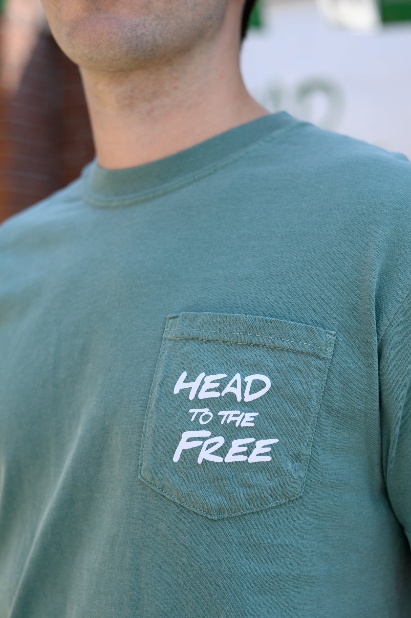 Innisfree Front Pocket Design with White text “Head To The Free”