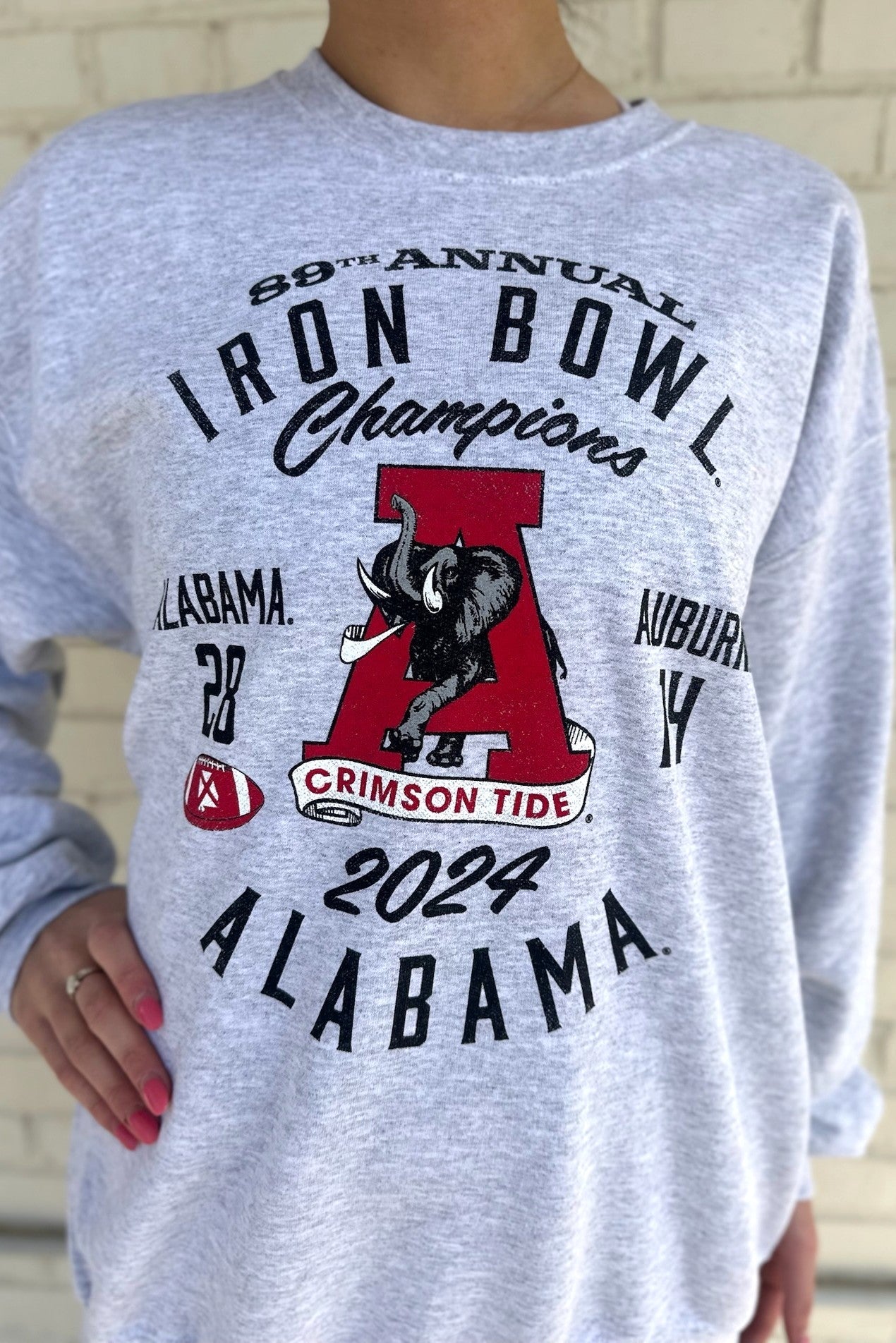 University of Alabama Grey 2024 Iron Bowl Champions Sweatshirts with the Vintage A logo surrounded by Black text detailing the winning score and the year