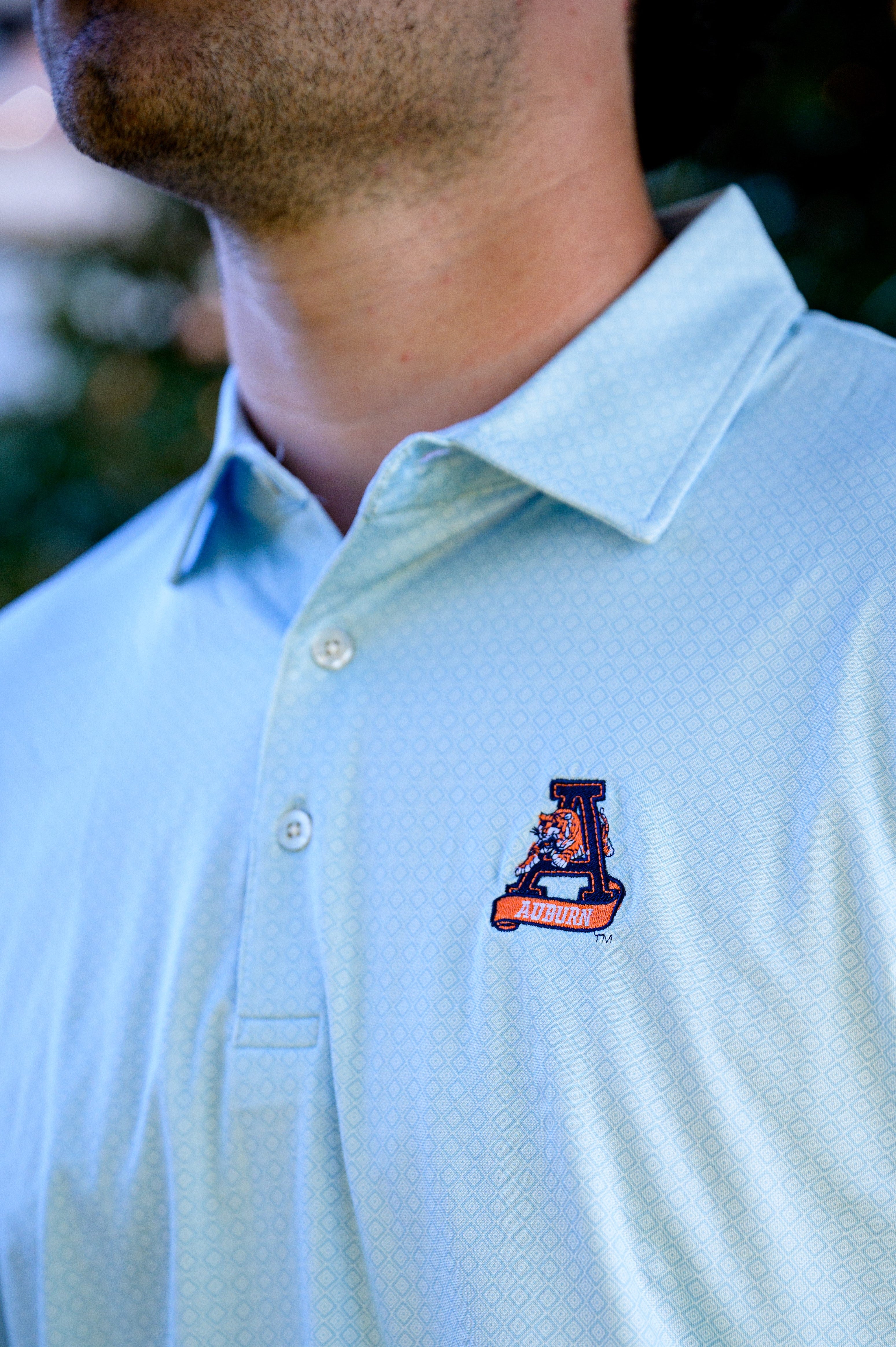Auburn University Light Blue Diamond Polo with embroidery of Aubie leaping through an "A"