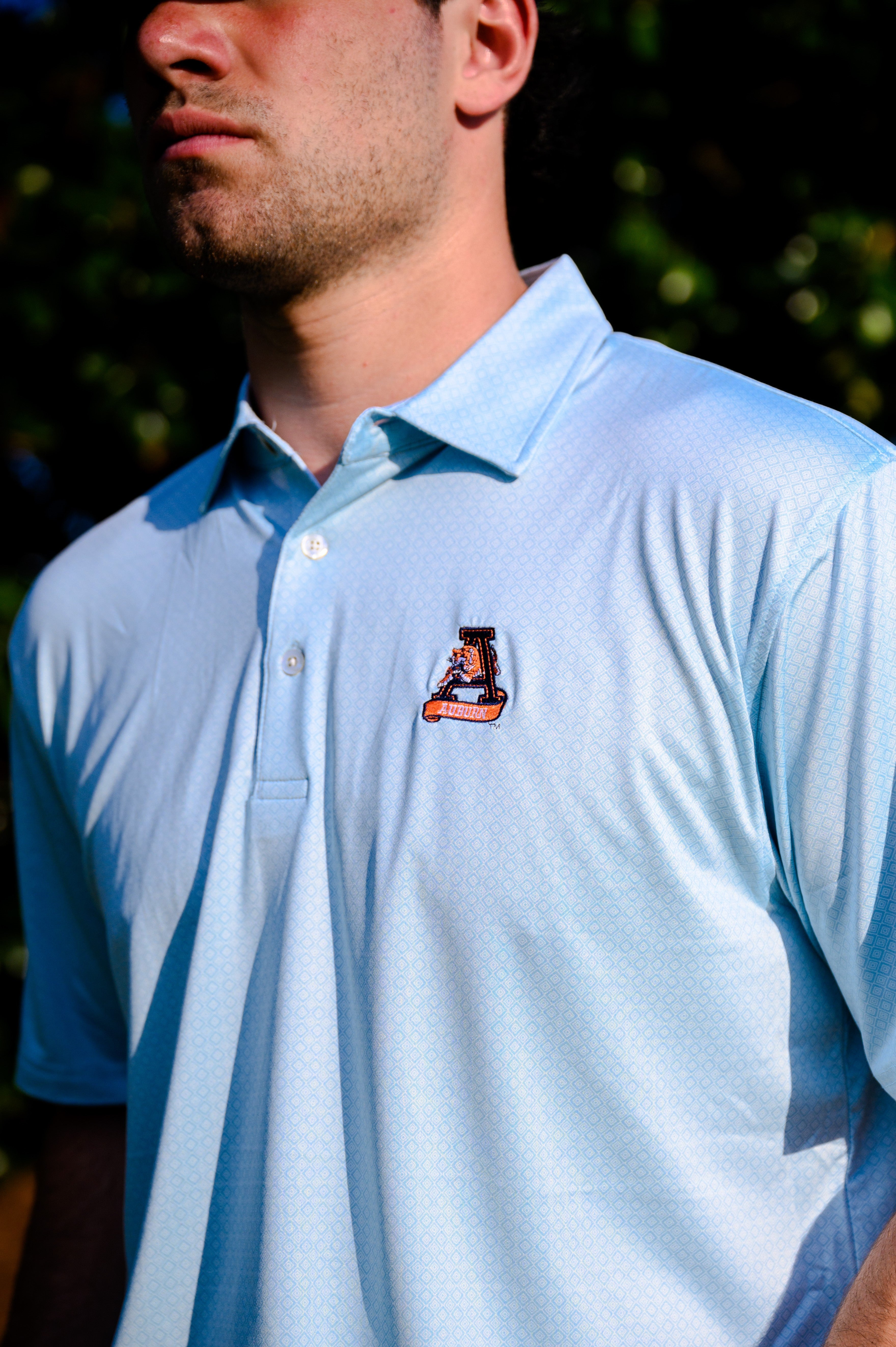 Auburn University Light Blue Diamond Polo with embroidery of Aubie leaping through an "A"