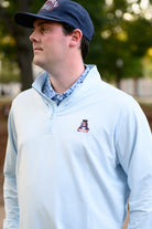 Auburn University Light Blue Men’s ¼ Zip with embroidery of Aubie leaping through an "A"