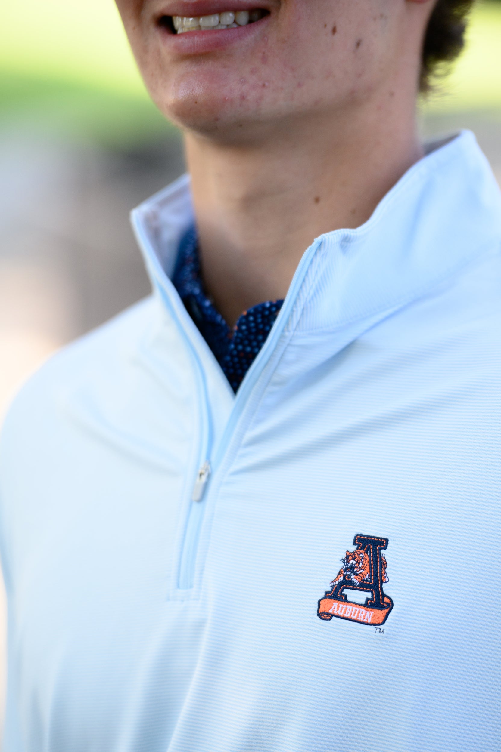 Auburn University Light Blue Men’s ¼ Zip with embroidery of Aubie leaping through an "A"