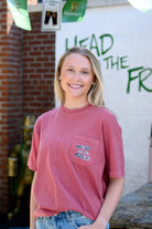 Innisfree Red Lucky Leprechaun T-Shirt with Black text “Head To The Free” on the front pocket