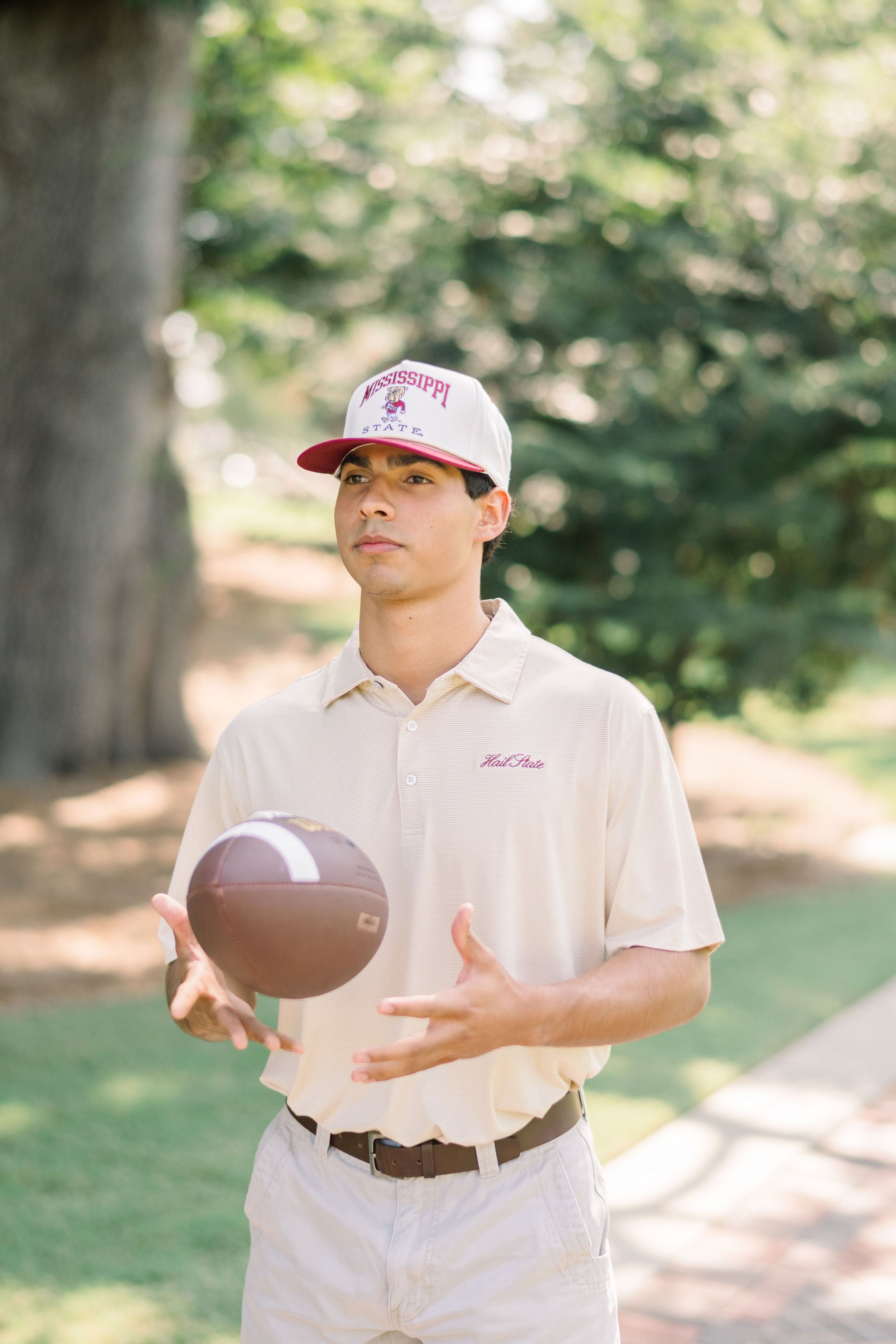 Mississippi State Men’s Tan Stripe Polo with Maroon Script “Hail State” Embroidered on the Chest