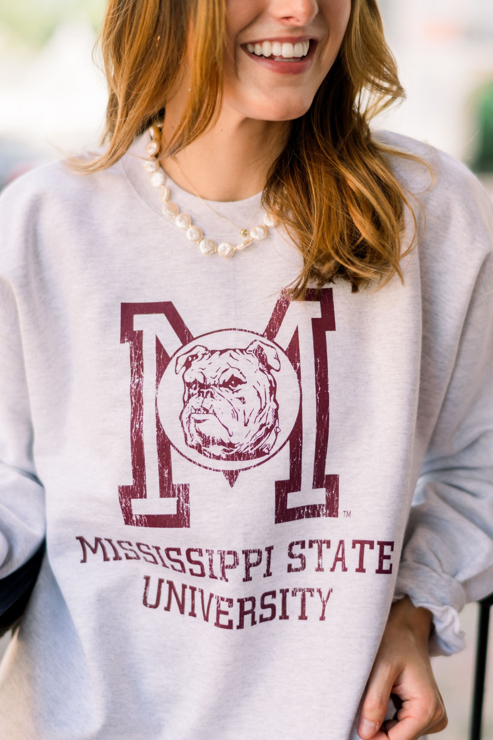Mississippi State Light Grey Sweatshirt with the Vintage State Logo above Maroon text “Mississippi State University”