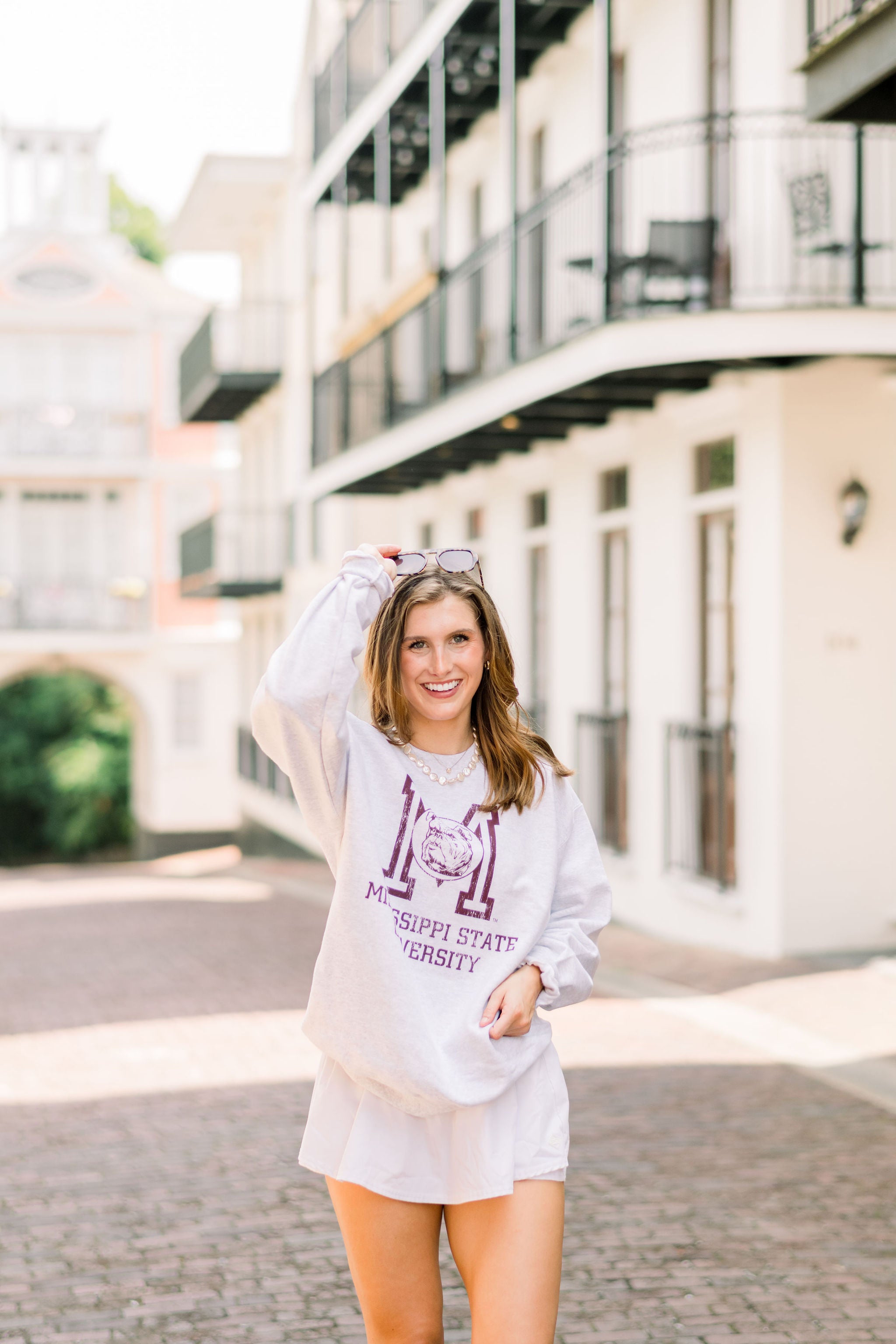 Mississippi State Light Grey Sweatshirt with the Vintage State Logo above Maroon text “Mississippi State University”