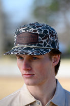 Mississippi State Camo Hat with a White rope and a leather patch with text “Mississippi State University”