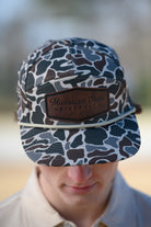Mississippi State Camo Hat with a White rope and a leather patch with text “Mississippi State University”