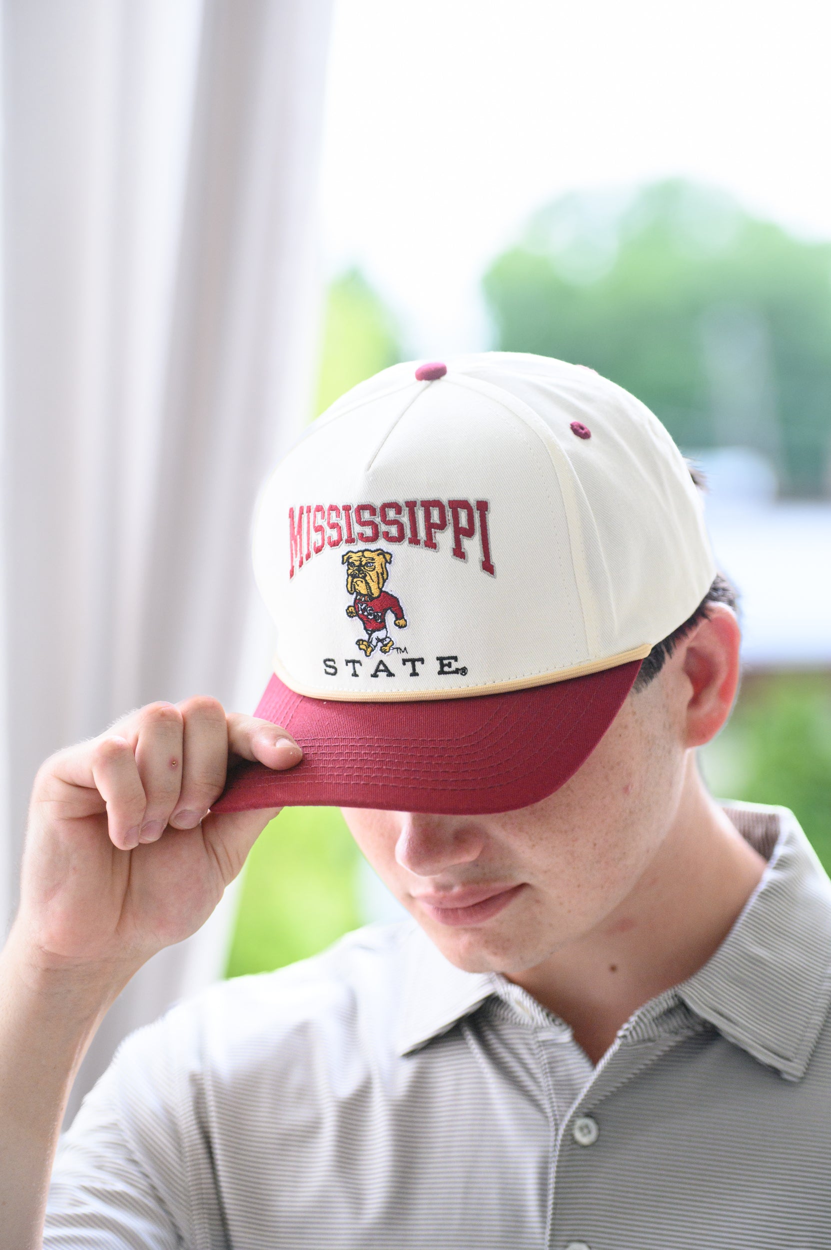Mississippi State Cream and Maroon Hat with the Walking Bully Logo in between embroidered text “Mississippi State” 