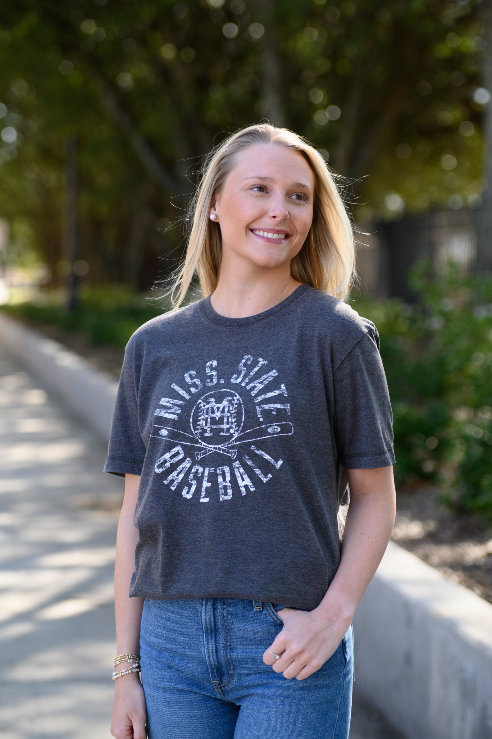 Mississippi State Distressed Dark Grey T-Shirt with a White Baseball featuring the MS overlapping logo over crossed baseball bats, surrounded by White text “Miss. State Baseball”