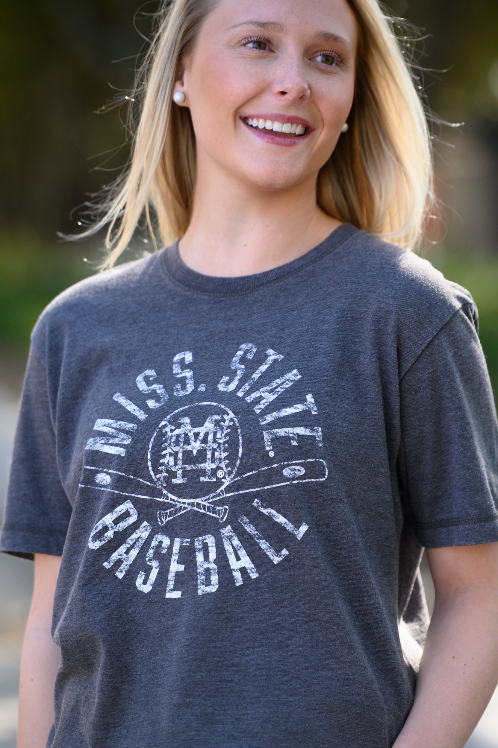 Mississippi State Distressed Dark Grey T-Shirt with a White Baseball featuring the MS overlapping logo over crossed baseball bats, surrounded by White text “Miss. State Baseball”