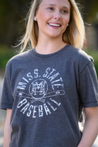 Mississippi State Distressed Dark Grey T-Shirt with a White Baseball featuring the MS overlapping logo over crossed baseball bats, surrounded by White text “Miss. State Baseball”