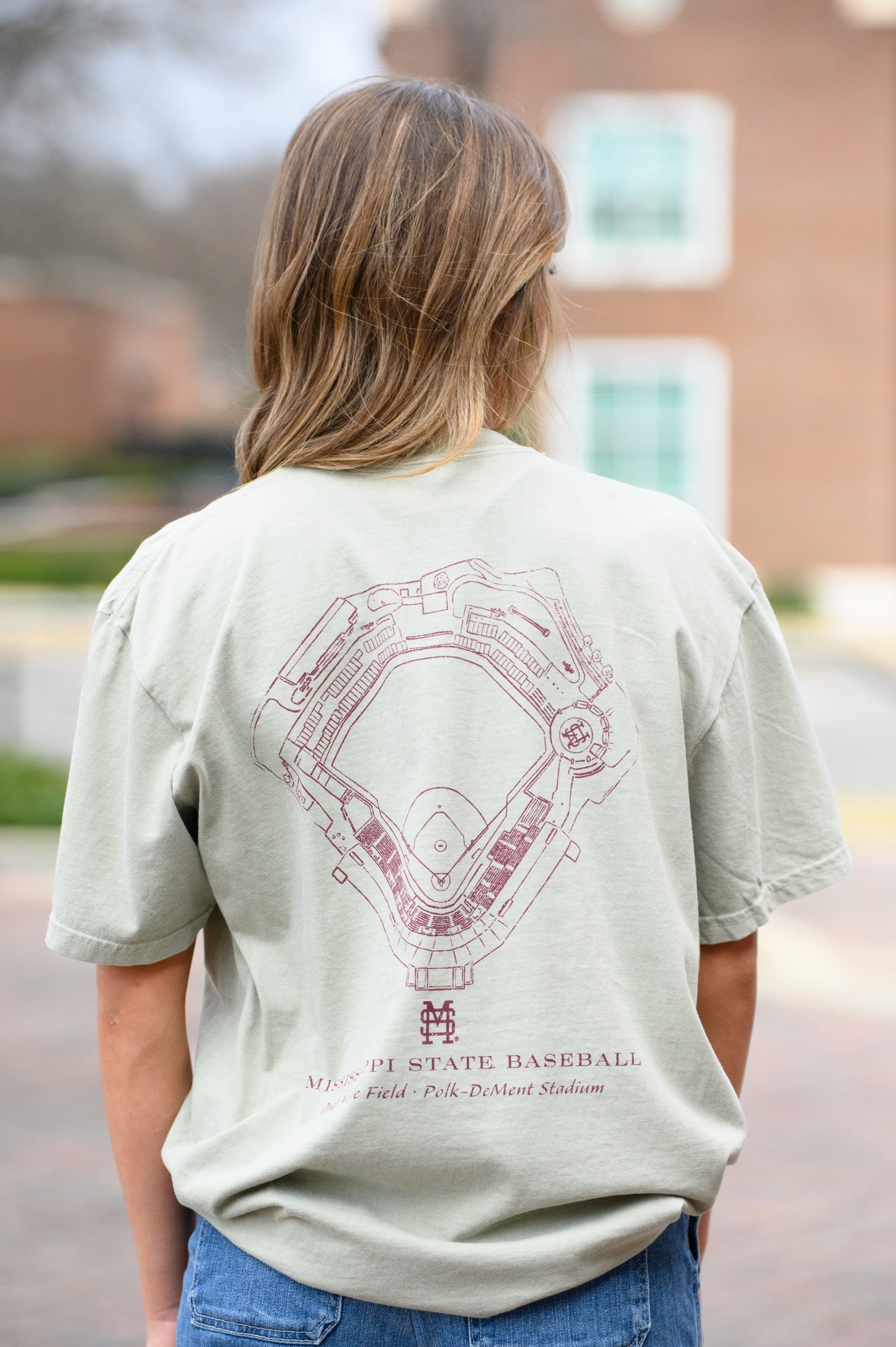 Mississippi State Sandstone Distressed Tee with a Maroon print of the Dudy-Noble Baseball Field blueprint above text “Mississippi Baseball”