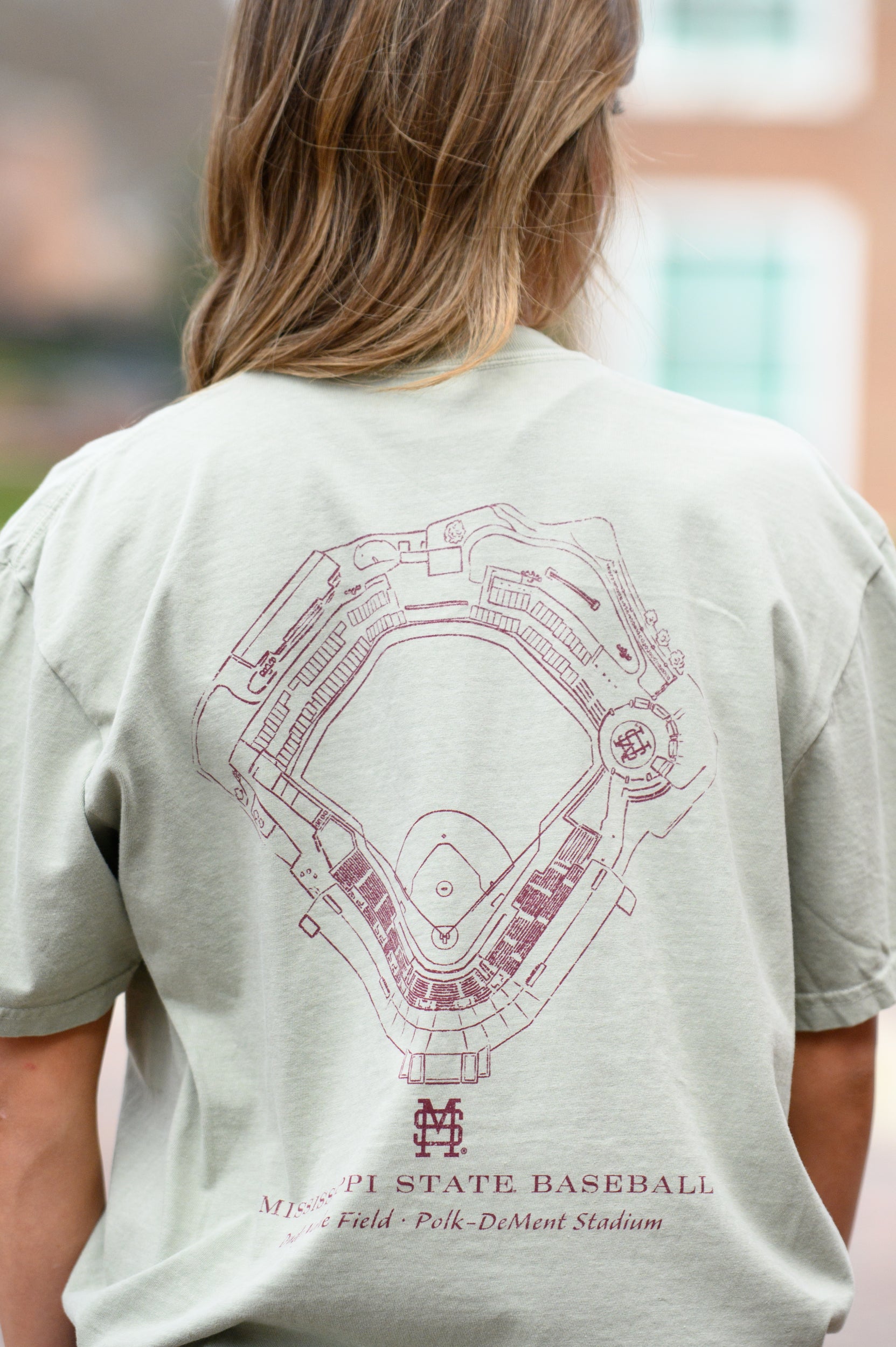 Mississippi State Sandstone Distressed Tee with a Maroon print of the Dudy-Noble Baseball Field blueprint above text “Mississippi Baseball”