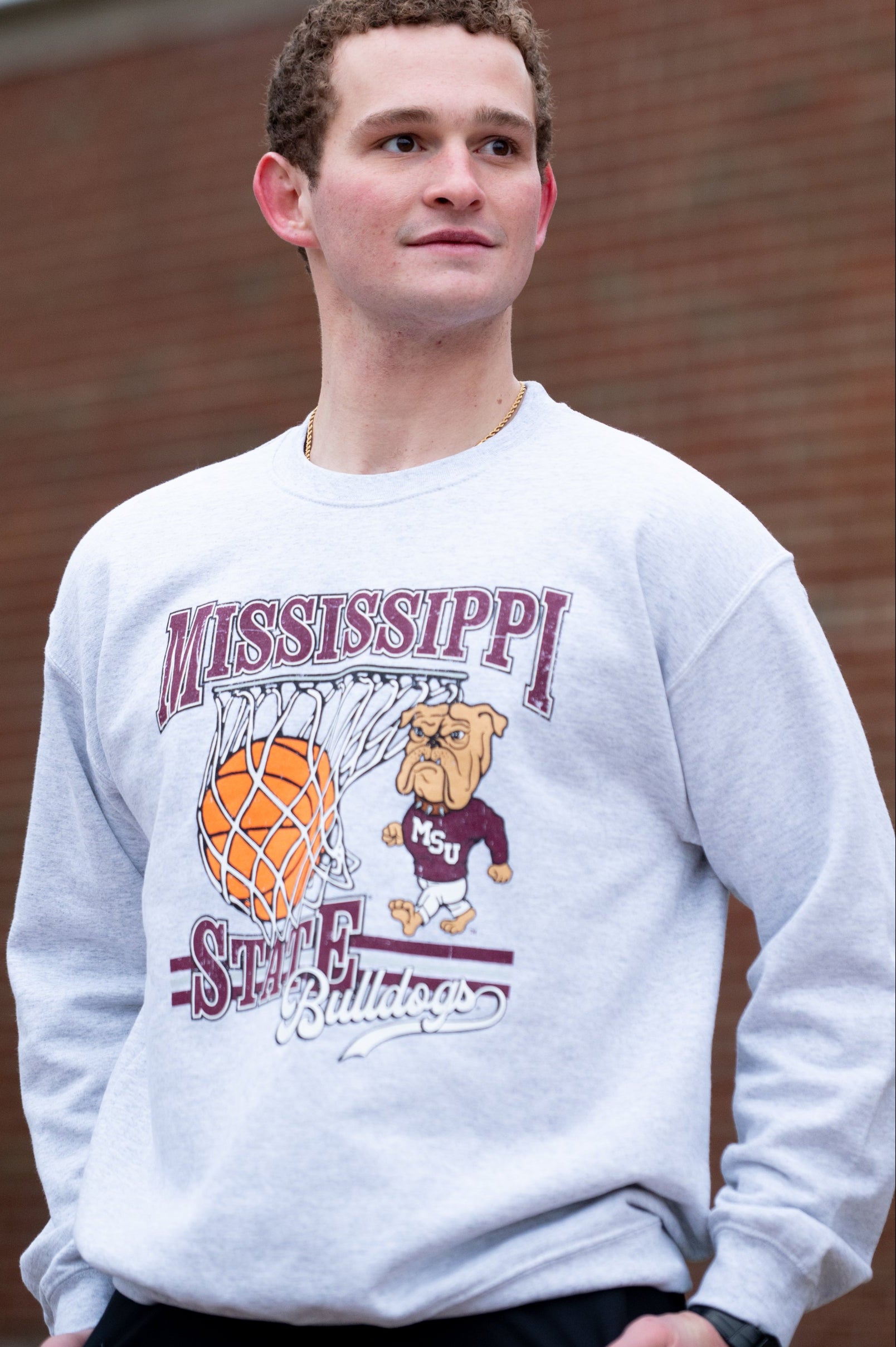 Mississippi State Light Grey Heather Sweatshirt with a basketball landing in a hoop between text “Mississippi” and “State” and next to Bully