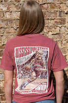 Mississippi State Crimson T-Shirt with a basketball card style design featuring Bully dribbling a basketball down the court in between text “Mississippi State Basketball” and “The Hump Humphrey Coliseum”