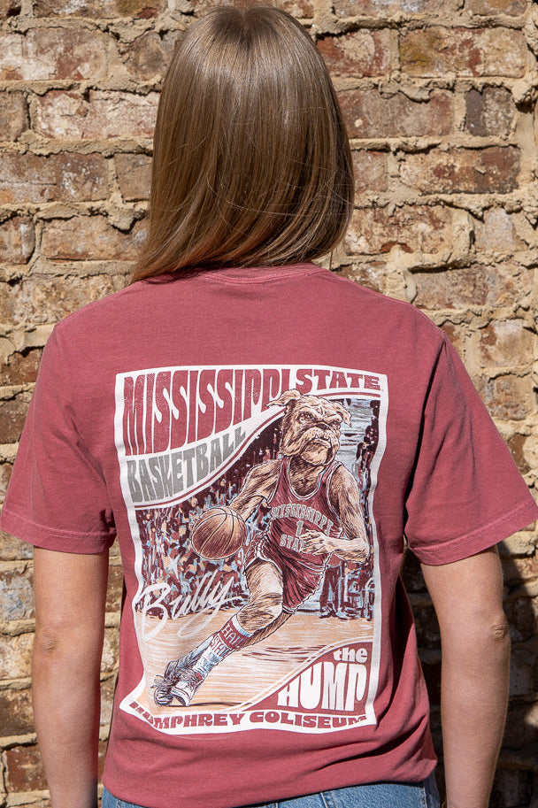 Mississippi State Crimson T-Shirt with a basketball card style design featuring Bully dribbling a basketball down the court in between text “Mississippi State Basketball” and “The Hump Humphrey Coliseum”