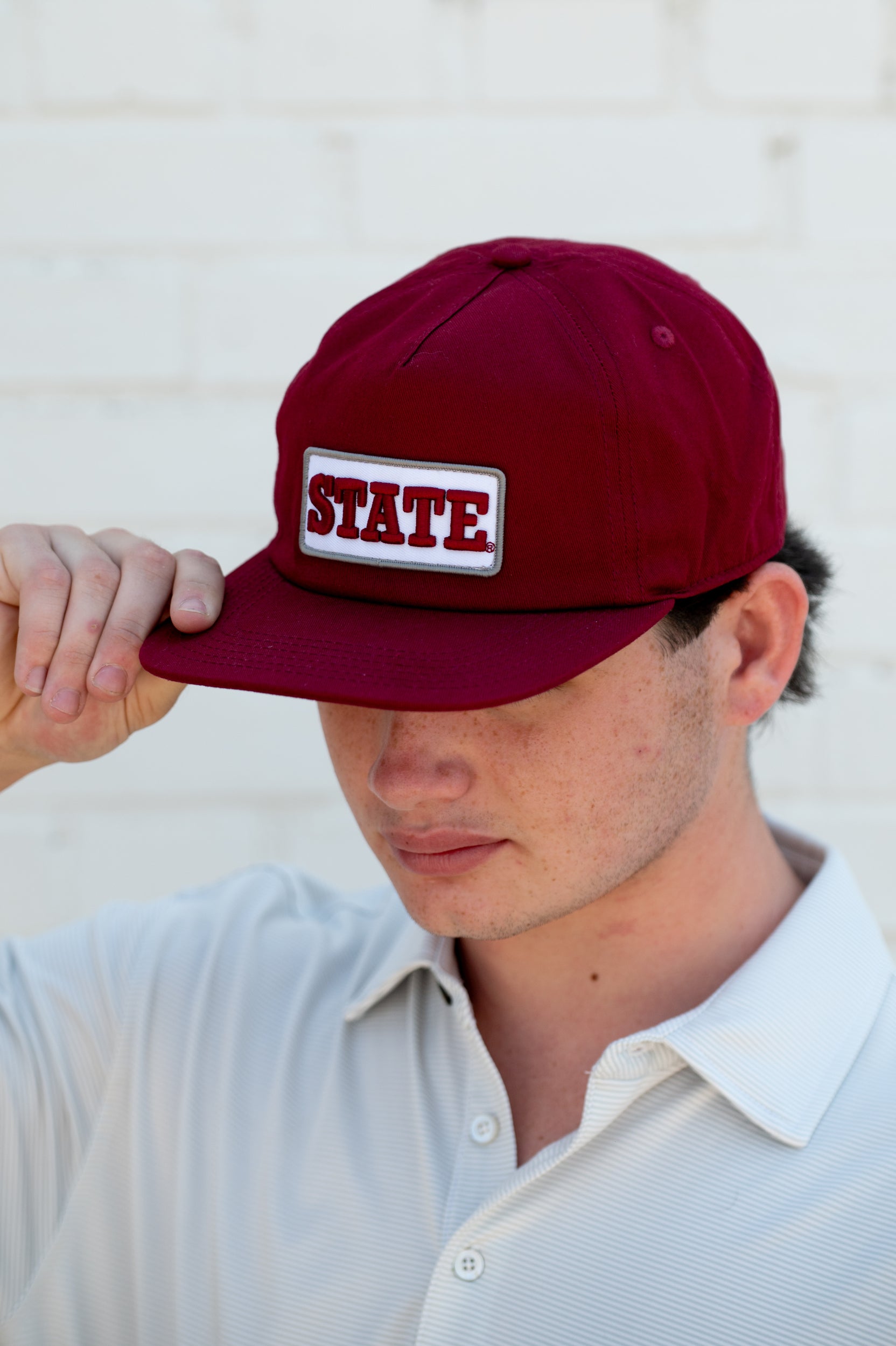 Mississippi State Maroon Snapback Hat featuring a White patch with Maroon “State” embroidery