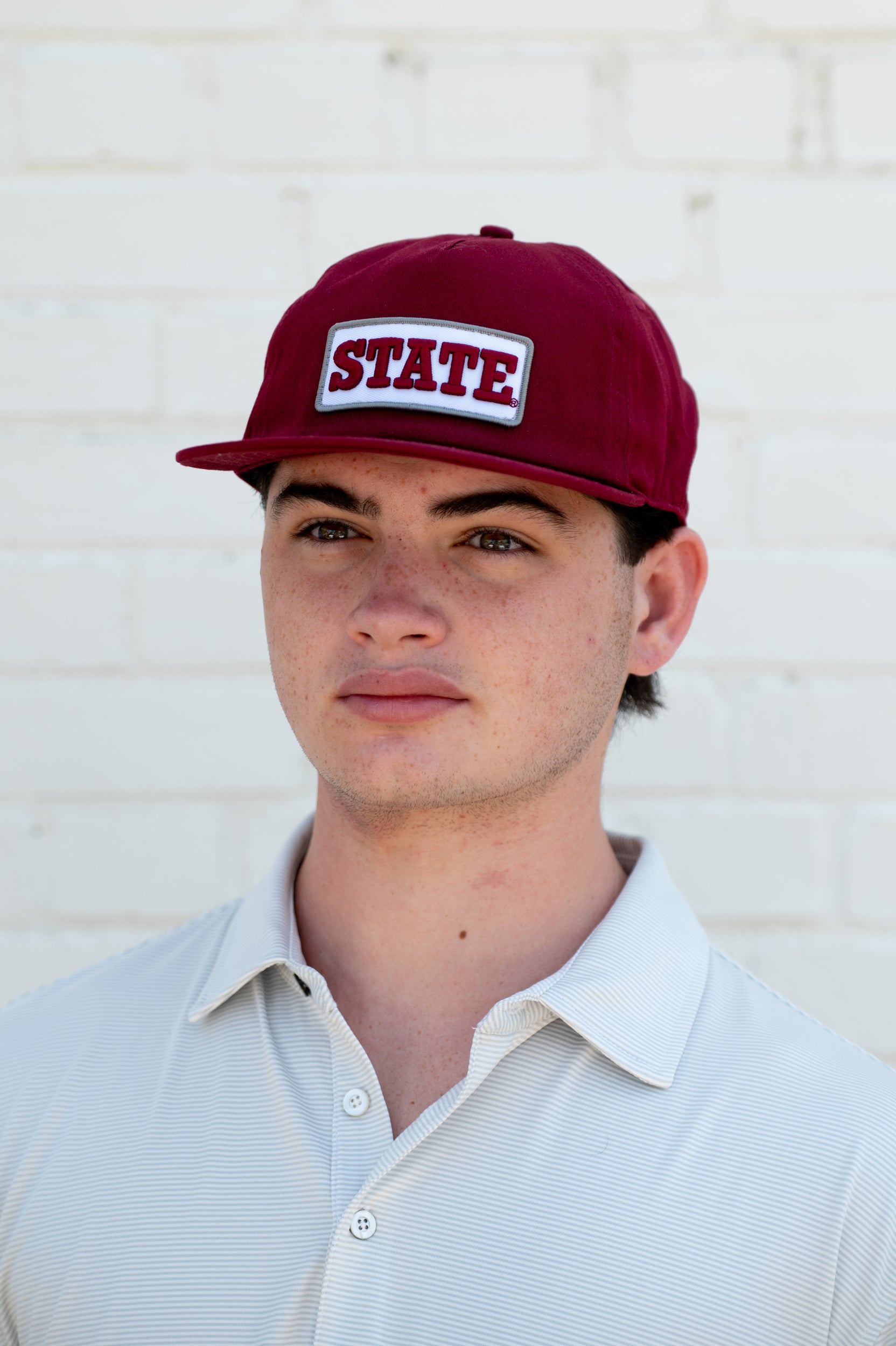 Mississippi State Maroon Snapback Hat featuring a White patch with Maroon “State” embroidery