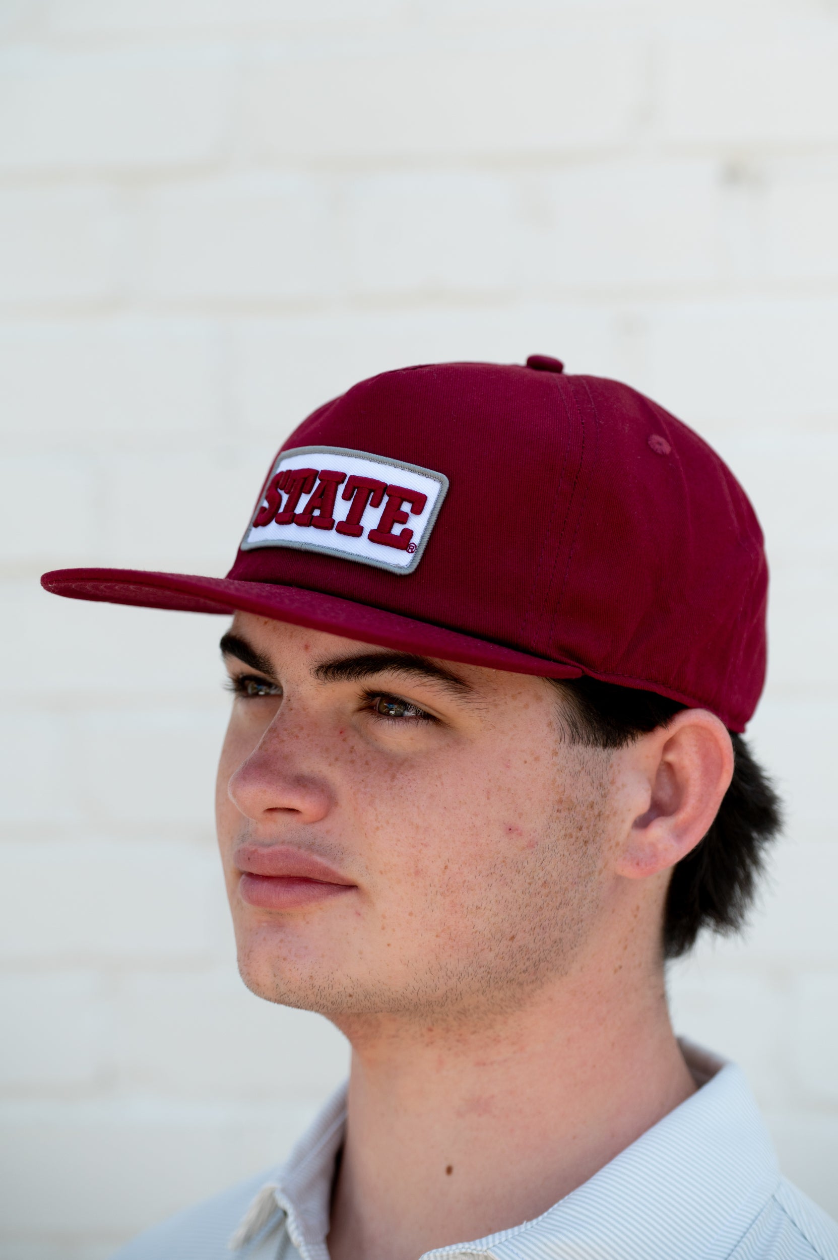 Mississippi State Maroon Snapback Hat featuring a White patch with Maroon “State” embroidery