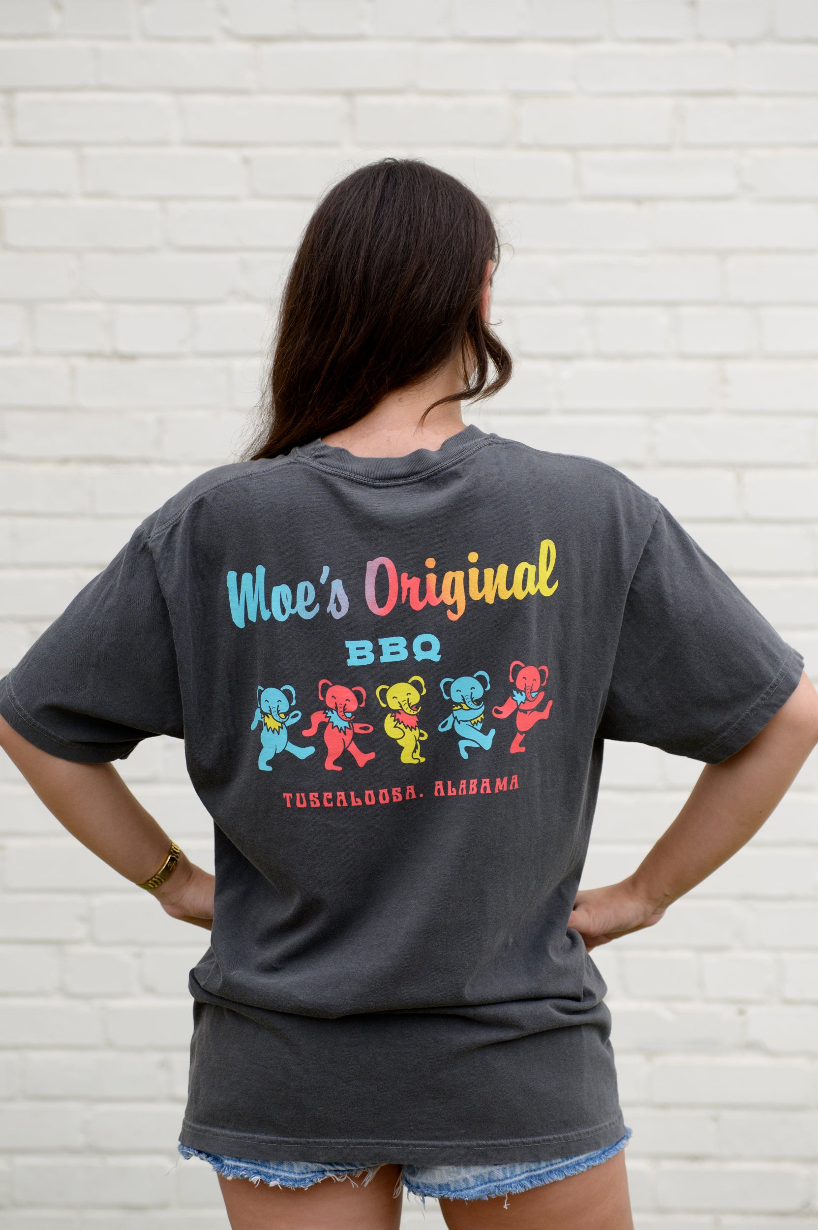 Moe's Grey Grateful Elephant T-Shirt with text "Moe's Original BBQ" above five dancing elephants