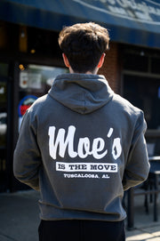 Moe's Dark Grey Hoodie with White text "Moe's” and Grey text in a White Block, “Is The Move" printed on the back