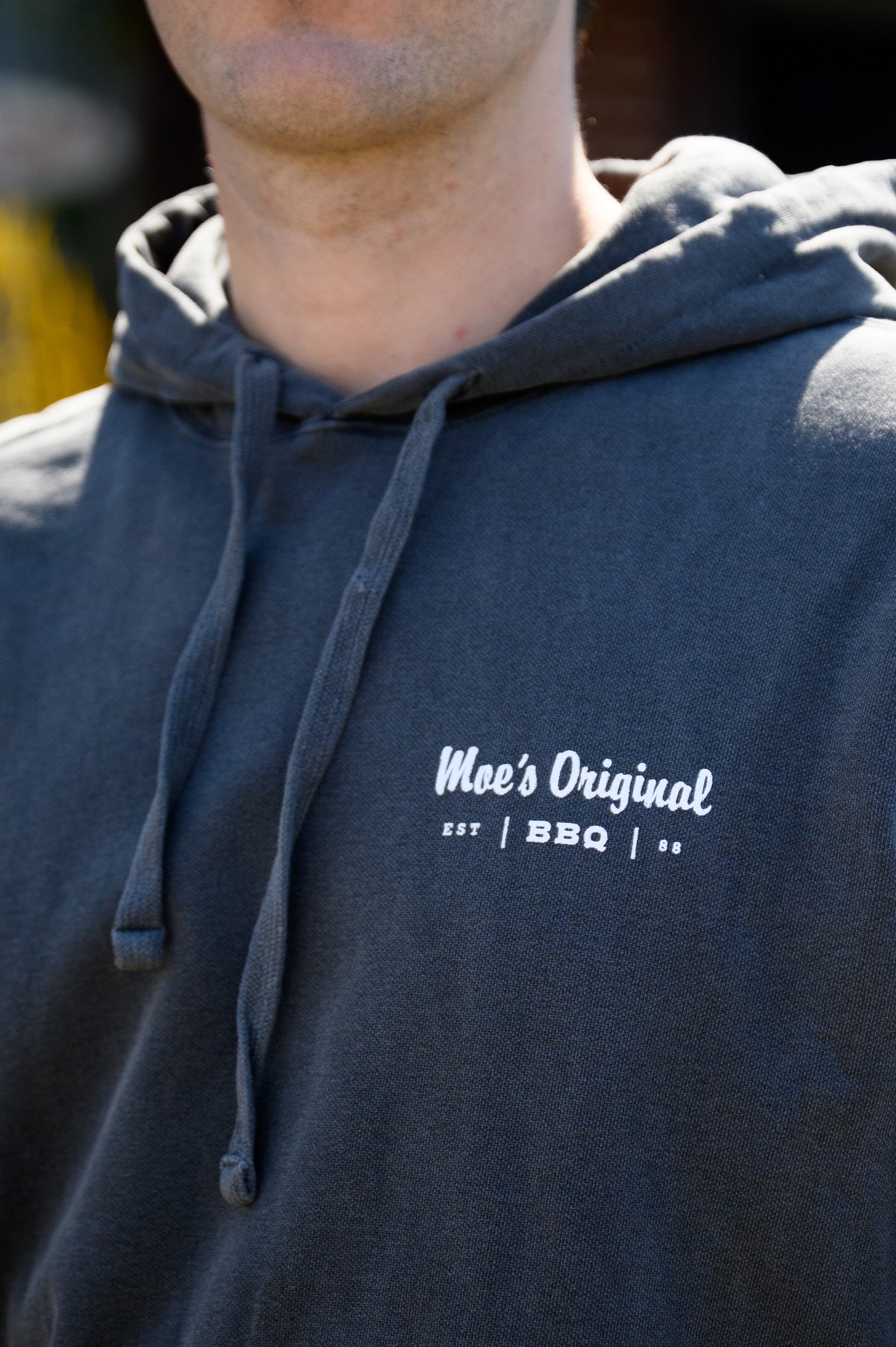 White “Moe’s BBQ” logo left chest design