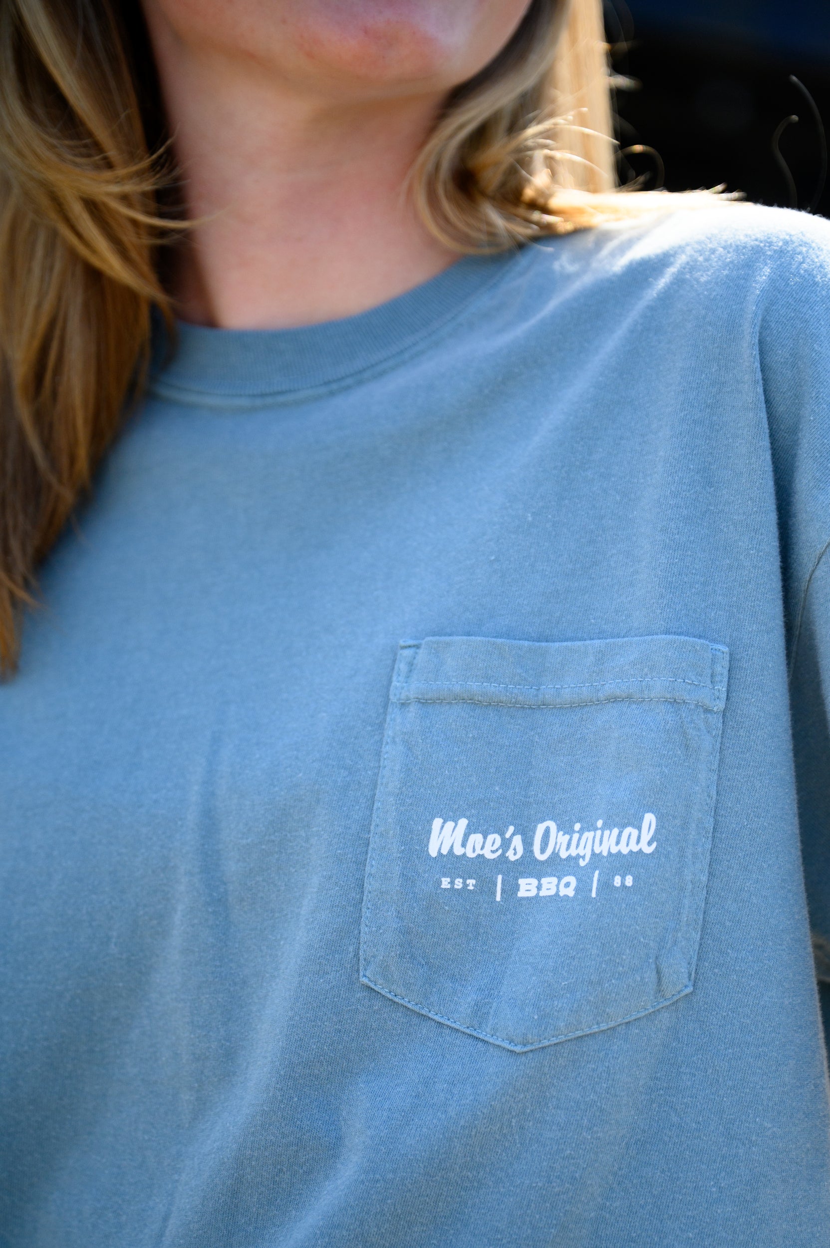 White “Moe’s BBQ” logo front pocket design