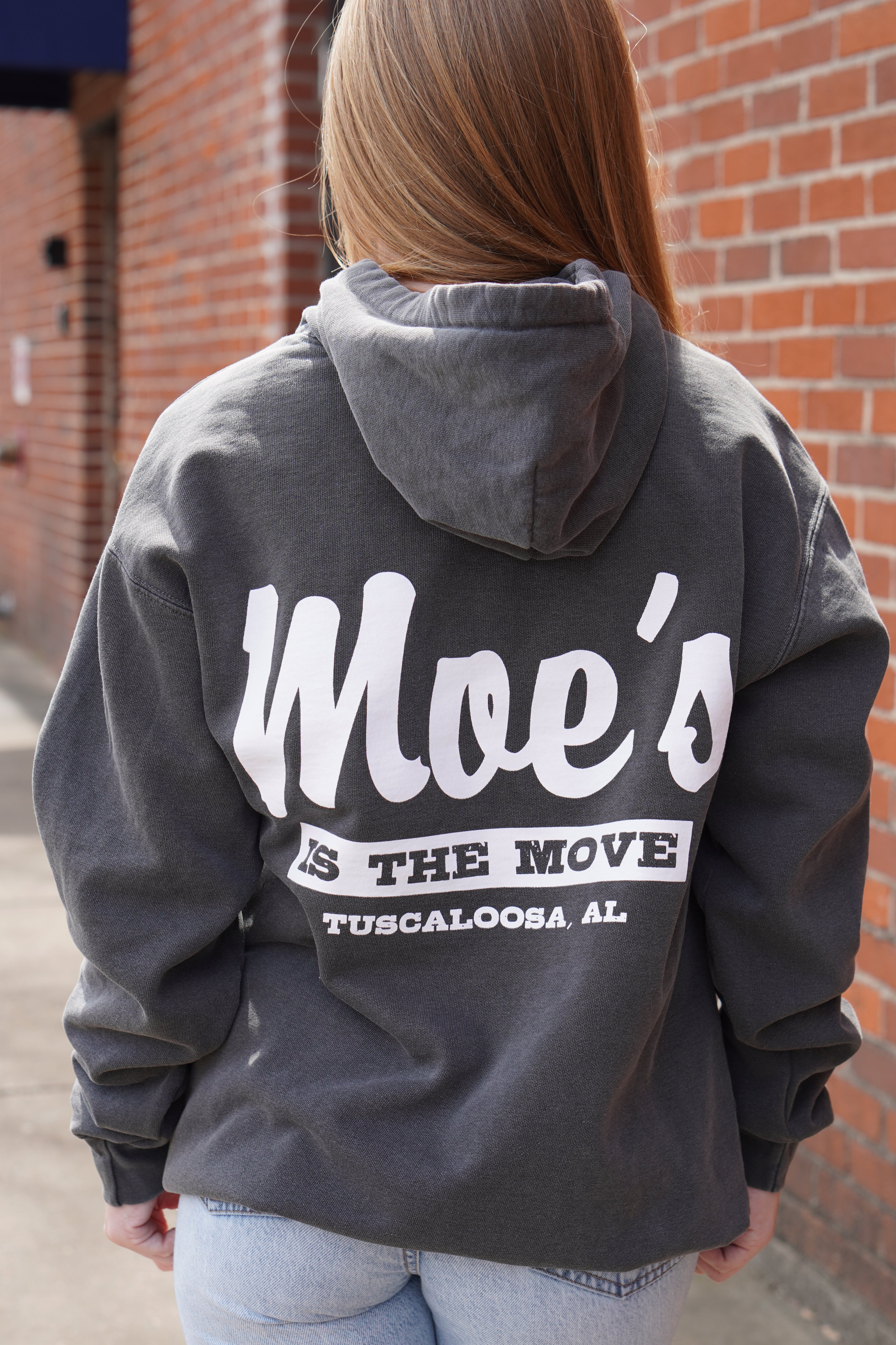 Moe's Grey Hoodie with White text "Moe's IS THE Move" printed on the back 