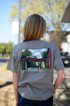 Local Merch Grey T-Shirt with a hand-drawn illustration of the Downtown Northport Train tracks above Black text "Northport, Alabama EST. 1871"